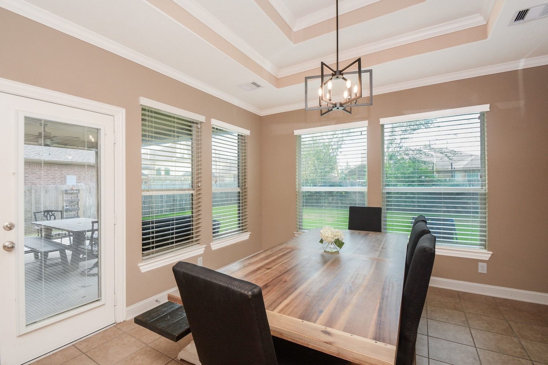 Large dining area with views to the backyard and large covered patio.