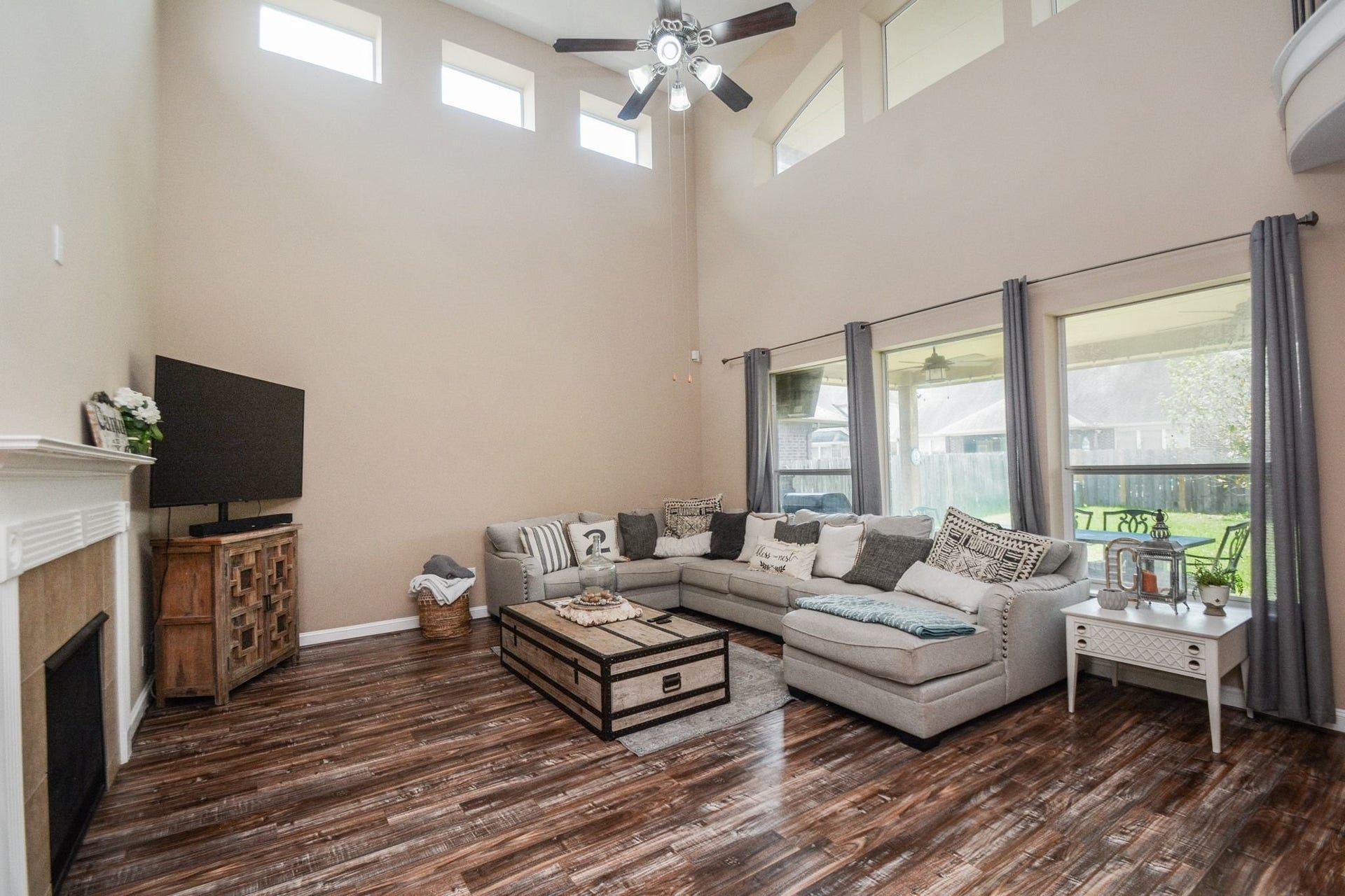 2 story family room with ceiling fan, gas log fireplace...