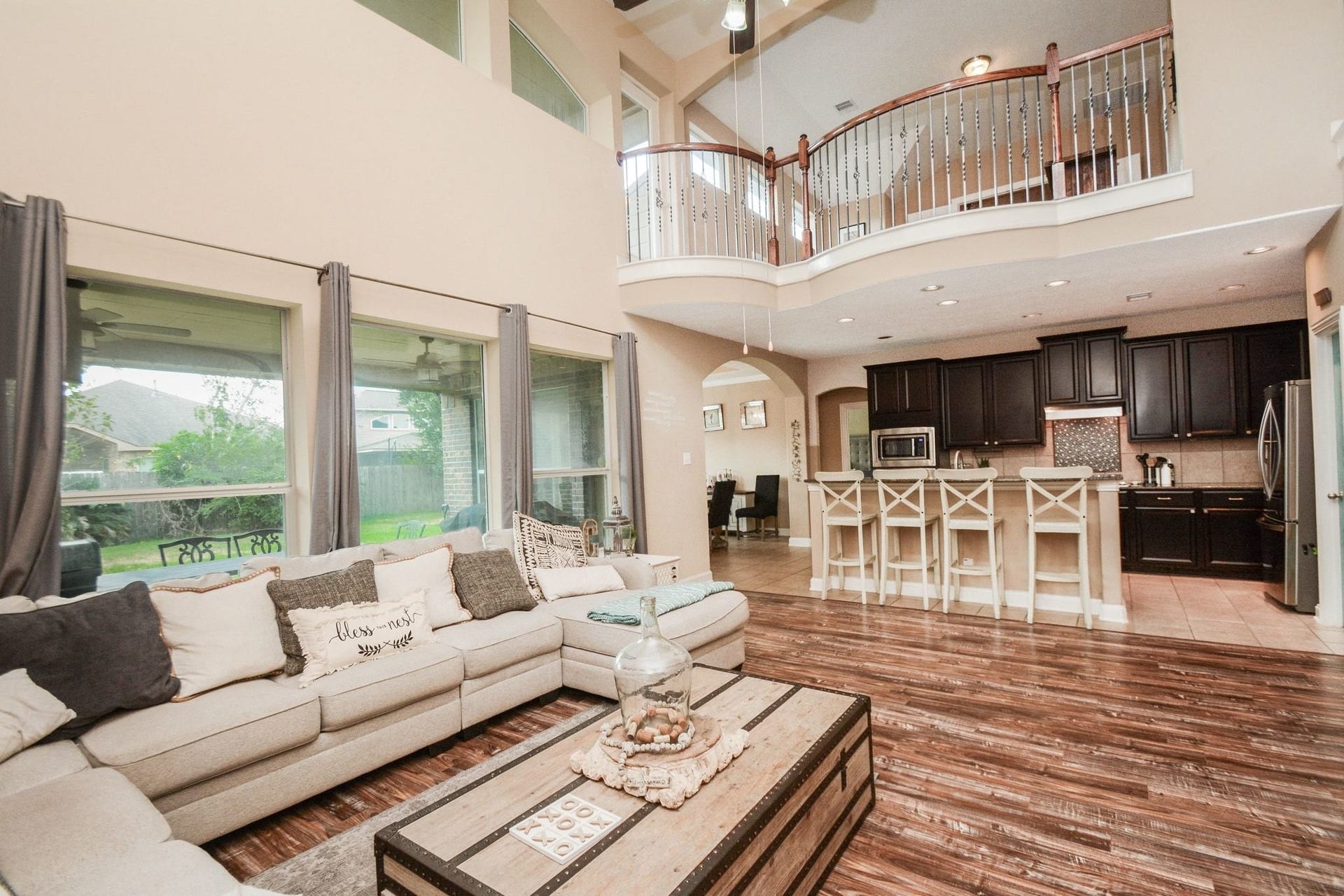 Family room open to kitchen. View up to gameroom.