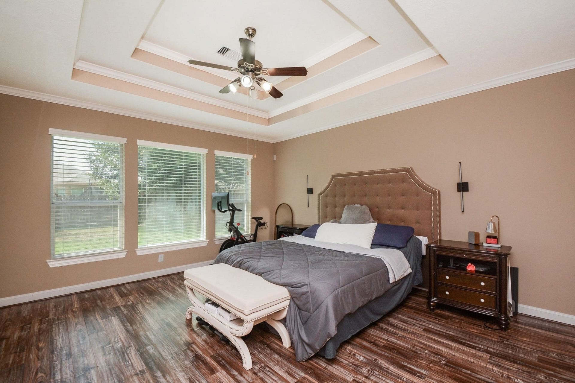 Primary Bedroom on 1st floor with large windows to backyard.