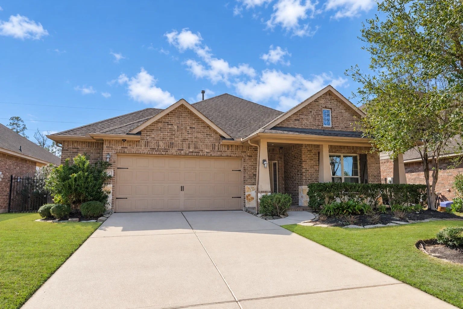103 W Wading Pond Circle, Tomball, TX 77375 Welcome home to this single-story brick residence nestled on a quiet cul-de-sac in Creekside Park. An inviting covered front porch, neat landscape beds, and an attached two-car garage set the stage for easy, single-level living.