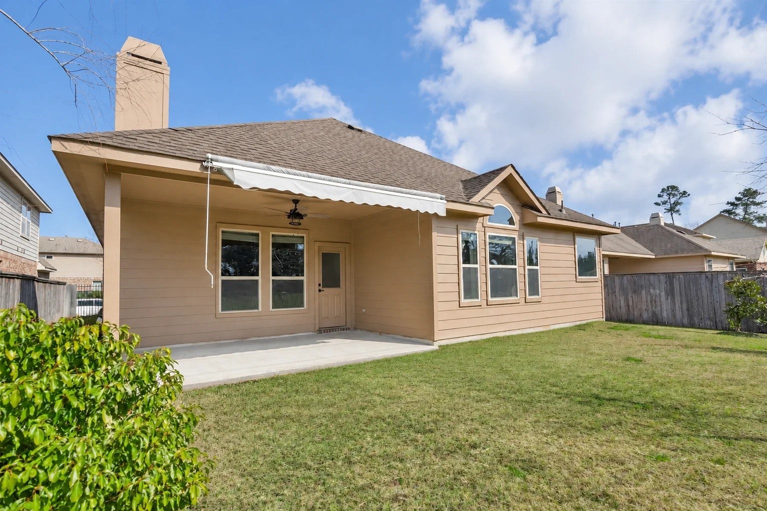 103 W Wading Pond Circle, Tomball, TX 77375 Step outside to a private backyard retreat with no rear neighbors. The wrought-iron perimeter fence opens up wide, serene views of the adjoining greenbelt, giving you a quiet, open-sky outdoor escape right at home.