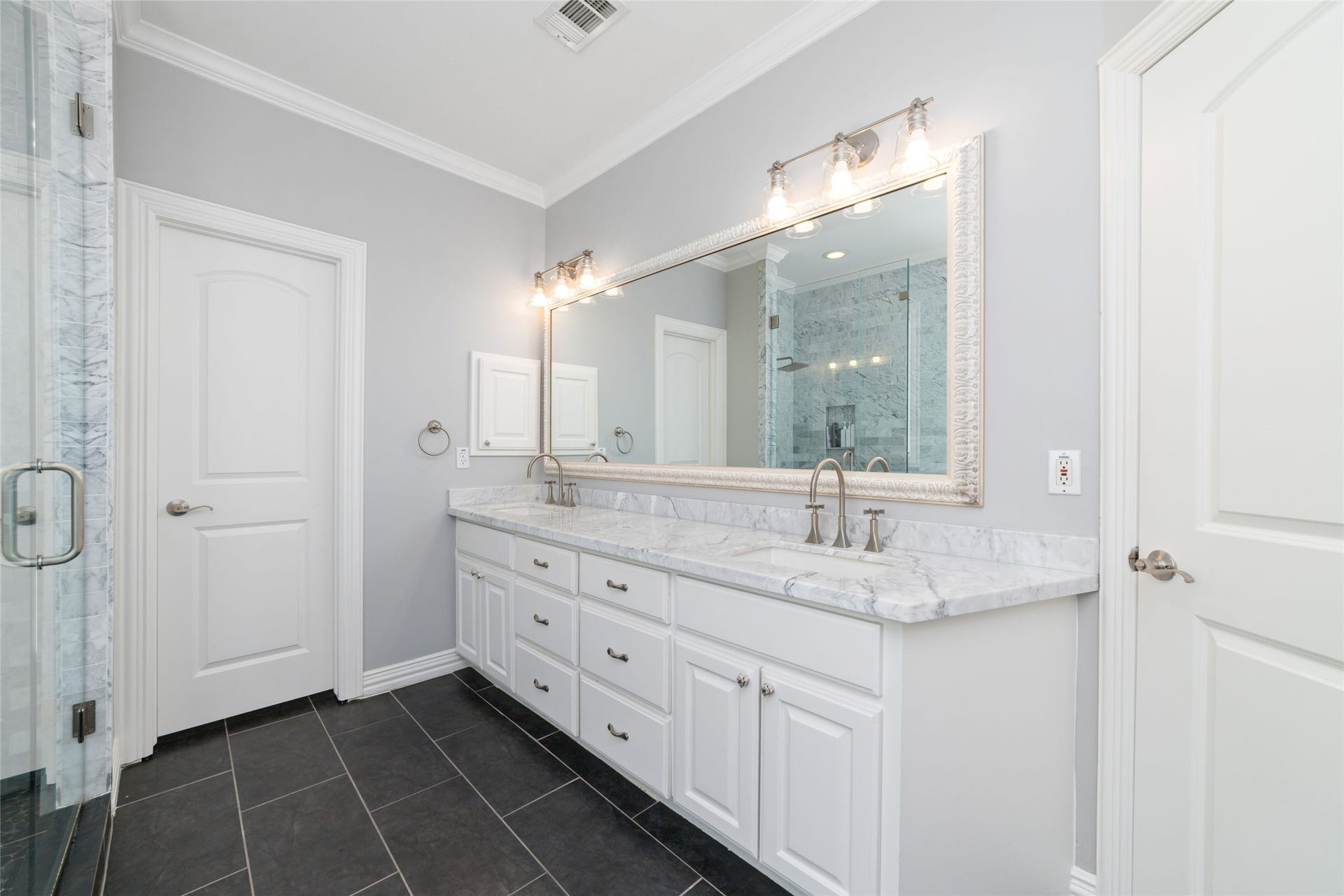 Dual vanities with private water closet