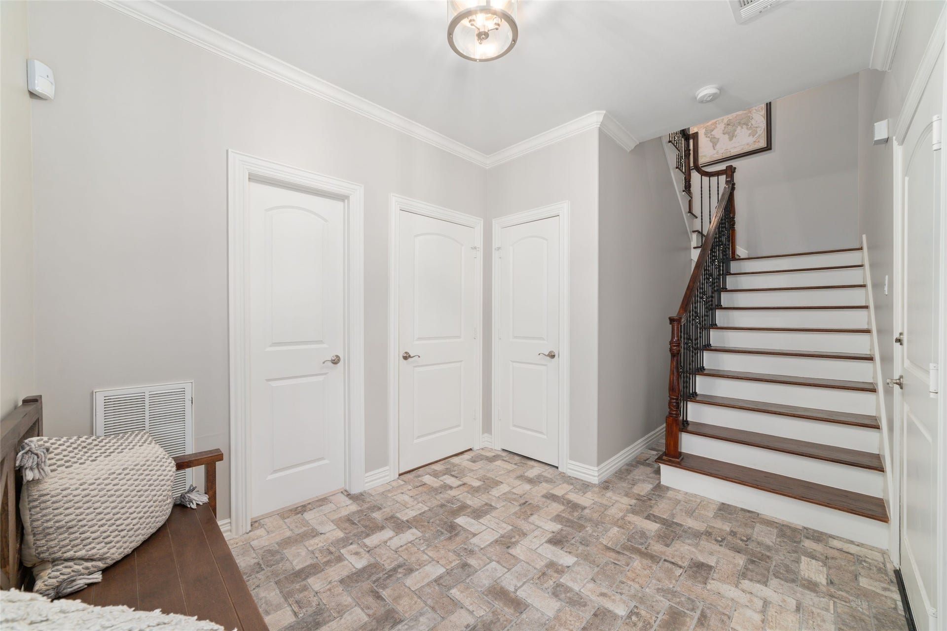 First floor landing with bedroom, full bathroom, storage and garage access.