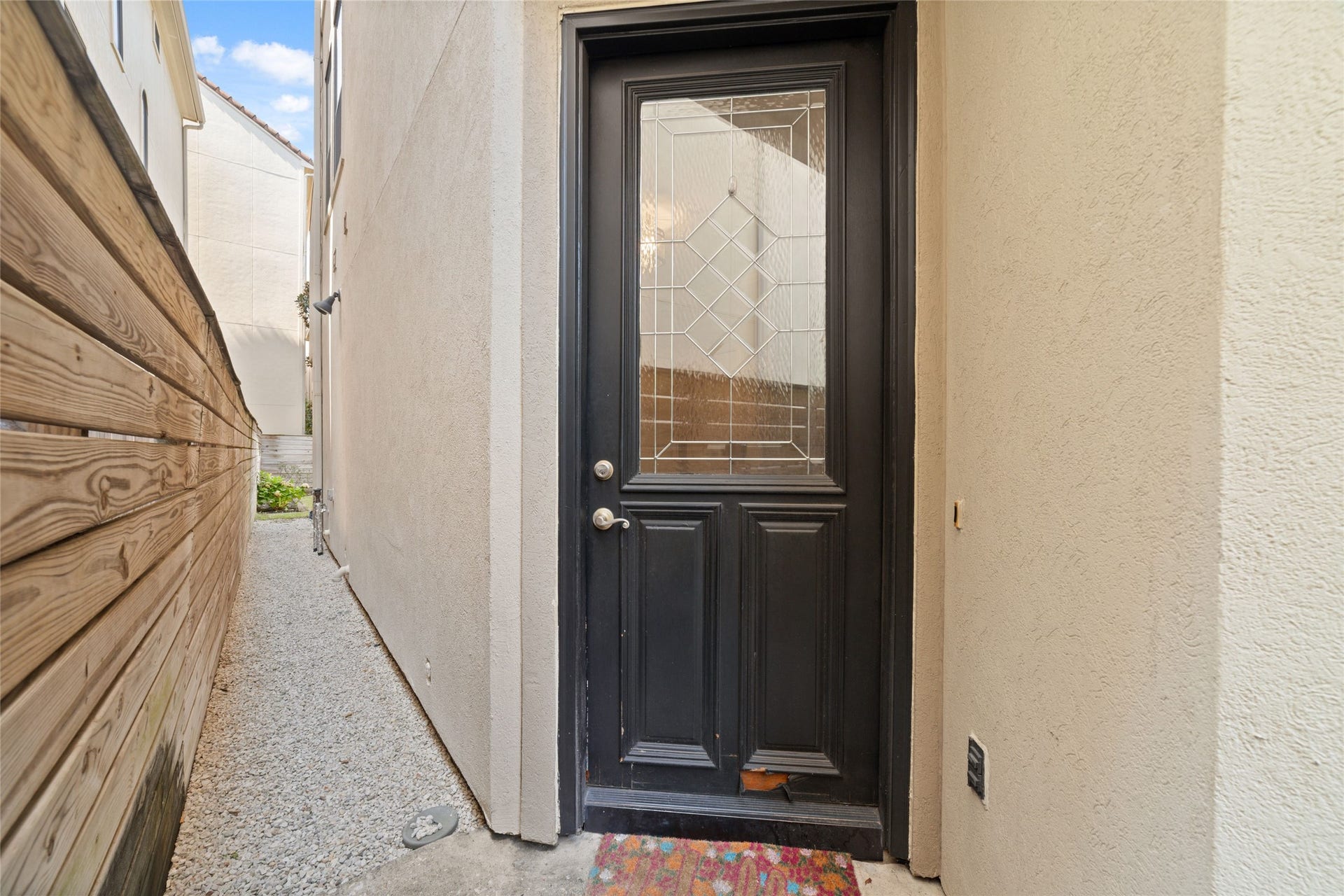 Front door behind a gated entry