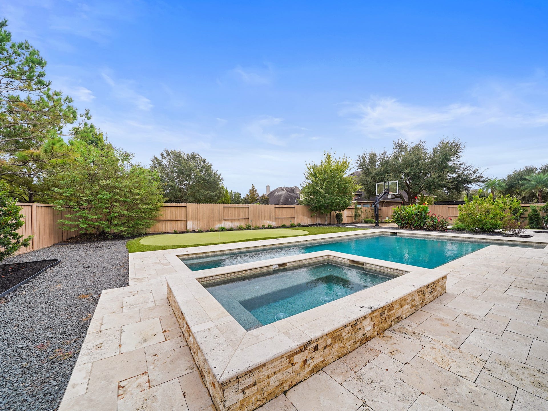 27710 Guthrie Ridge Lane, Katy, TX 77494 The heated pool and elevated spa become the centerpiece of the backyardequally inviting for a morning dip or a late-evening soak.