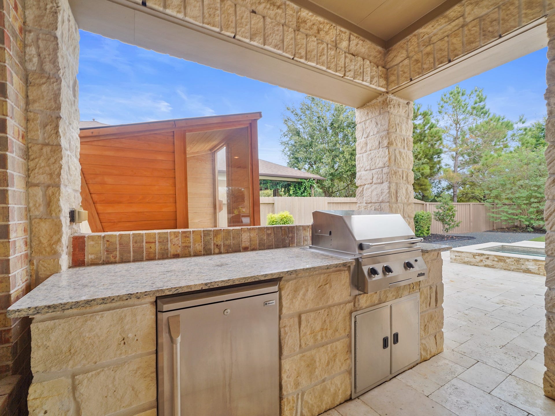 27710 Guthrie Ridge Lane, Katy, TX 77494 The outdoor kitchen is ready for relaxed weekend dinners, with a built-in grill and generous counter space for serving.