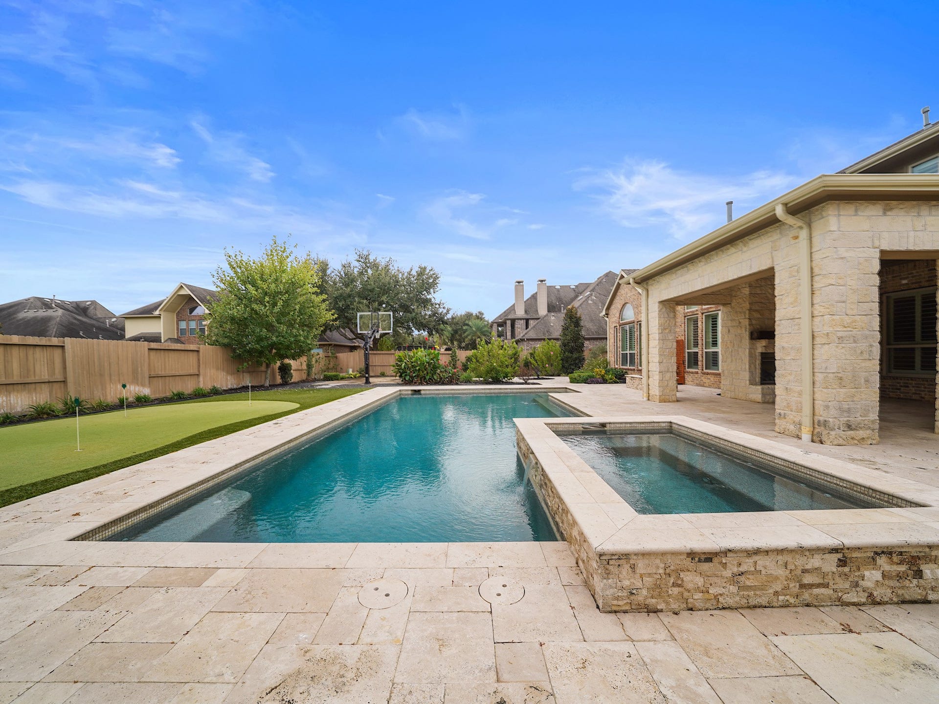 27710 Guthrie Ridge Lane, Katy, TX 77494 From this angle, the sculpted waterline and stone surround lend the pool area a polished, resort-inspired finish.