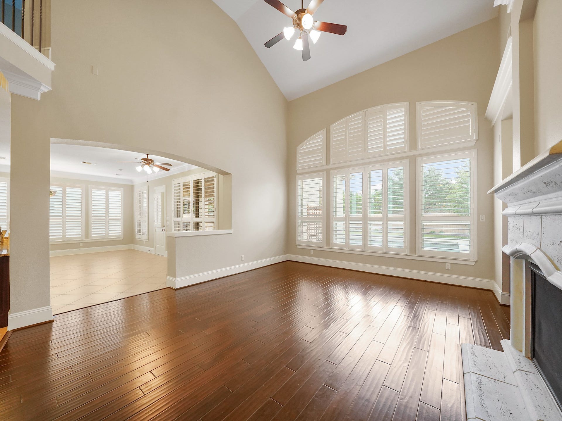 27710 Guthrie Ridge Lane, Katy, TX 77494 Arched, floor-to-ceiling windows fill the family room with natural light.