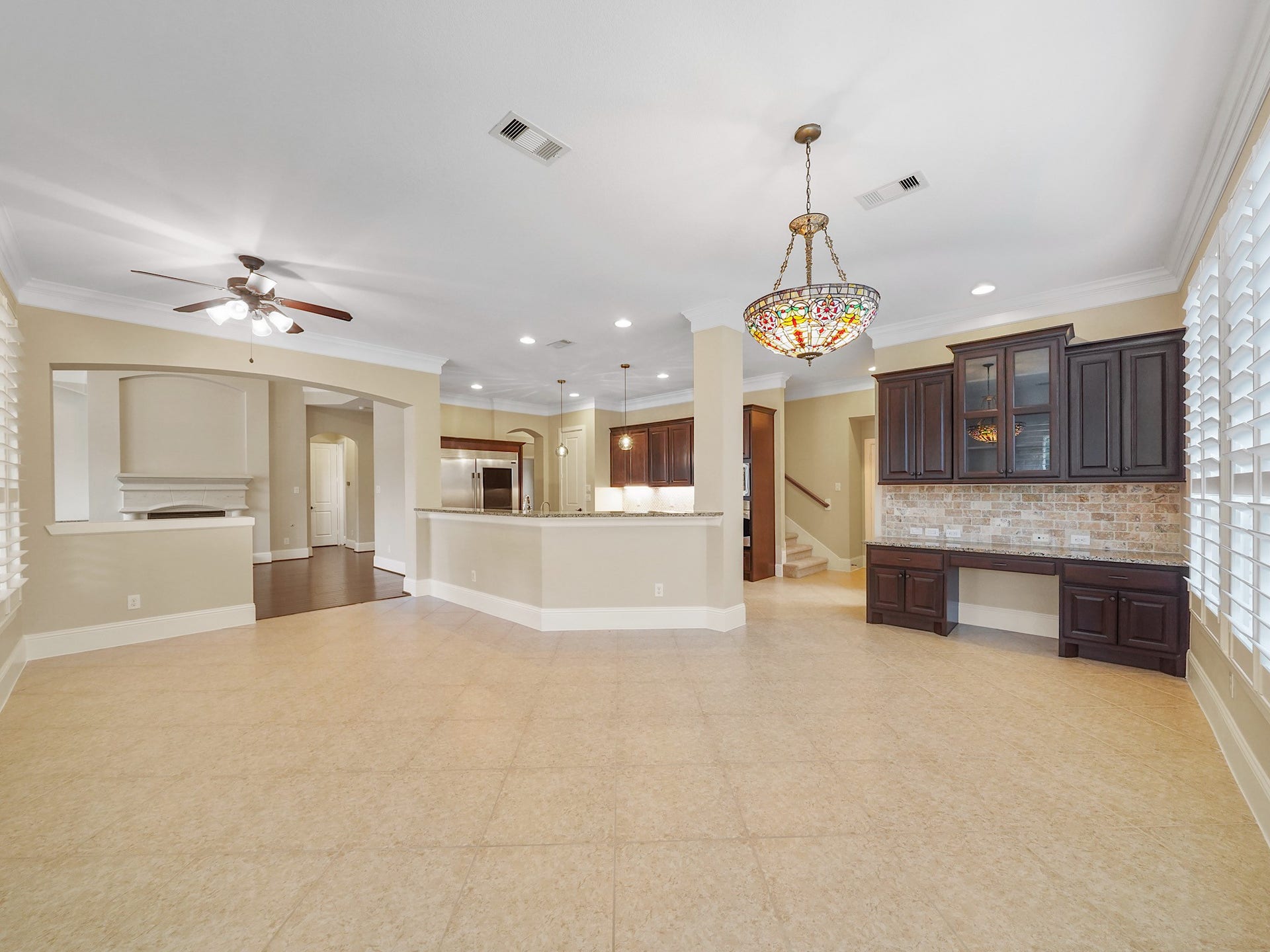 27710 Guthrie Ridge Lane, Katy, TX 77494 Beyond the kitchen, the generously scaled breakfast area leaves room to linger, with a built-in workstation tucked in for homework, planning, or a quiet day of work.