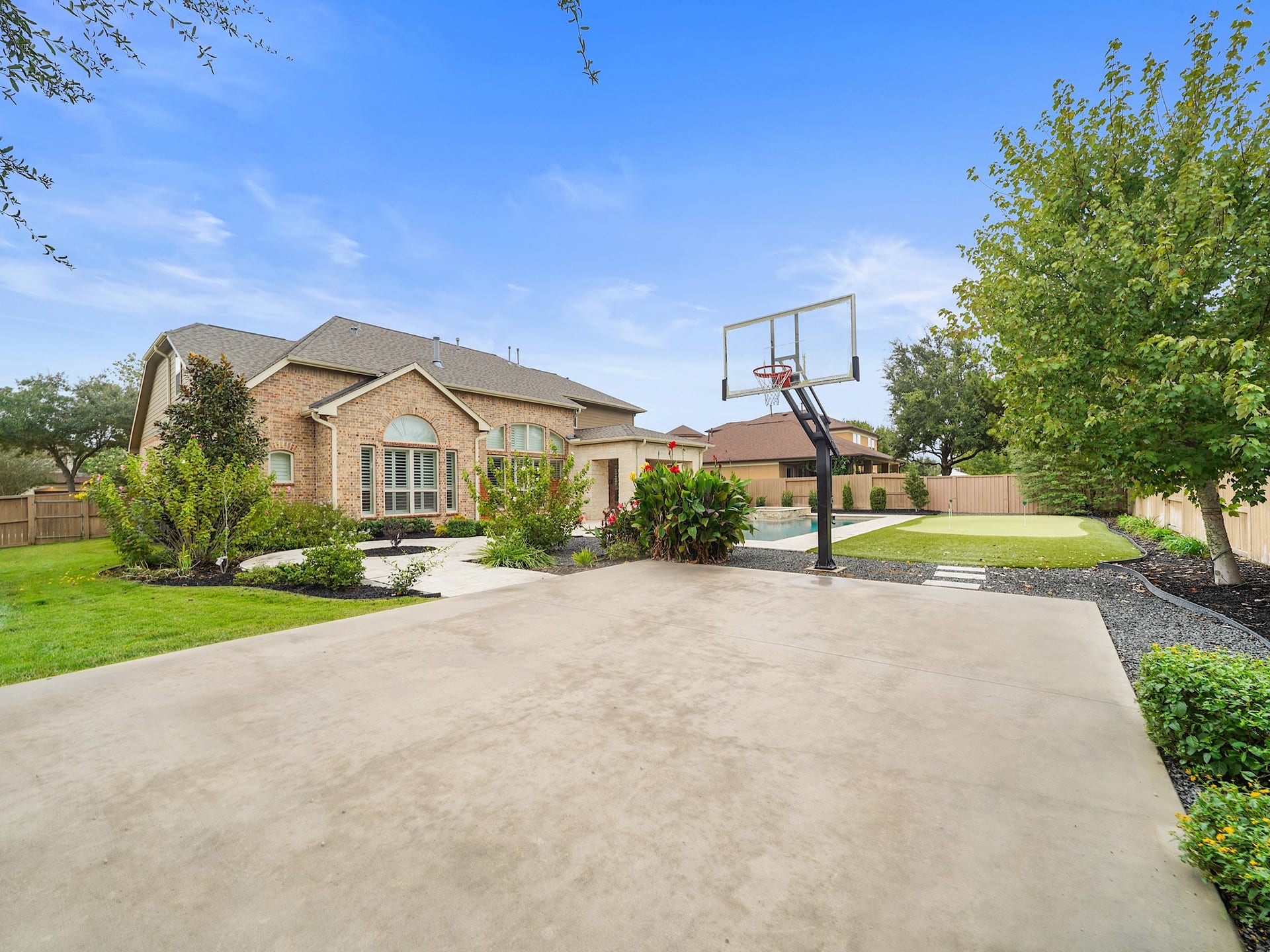 27710 Guthrie Ridge Lane, Katy, TX 77494 A dedicated sport court with a basketball goal puts another layer of recreation right at home.