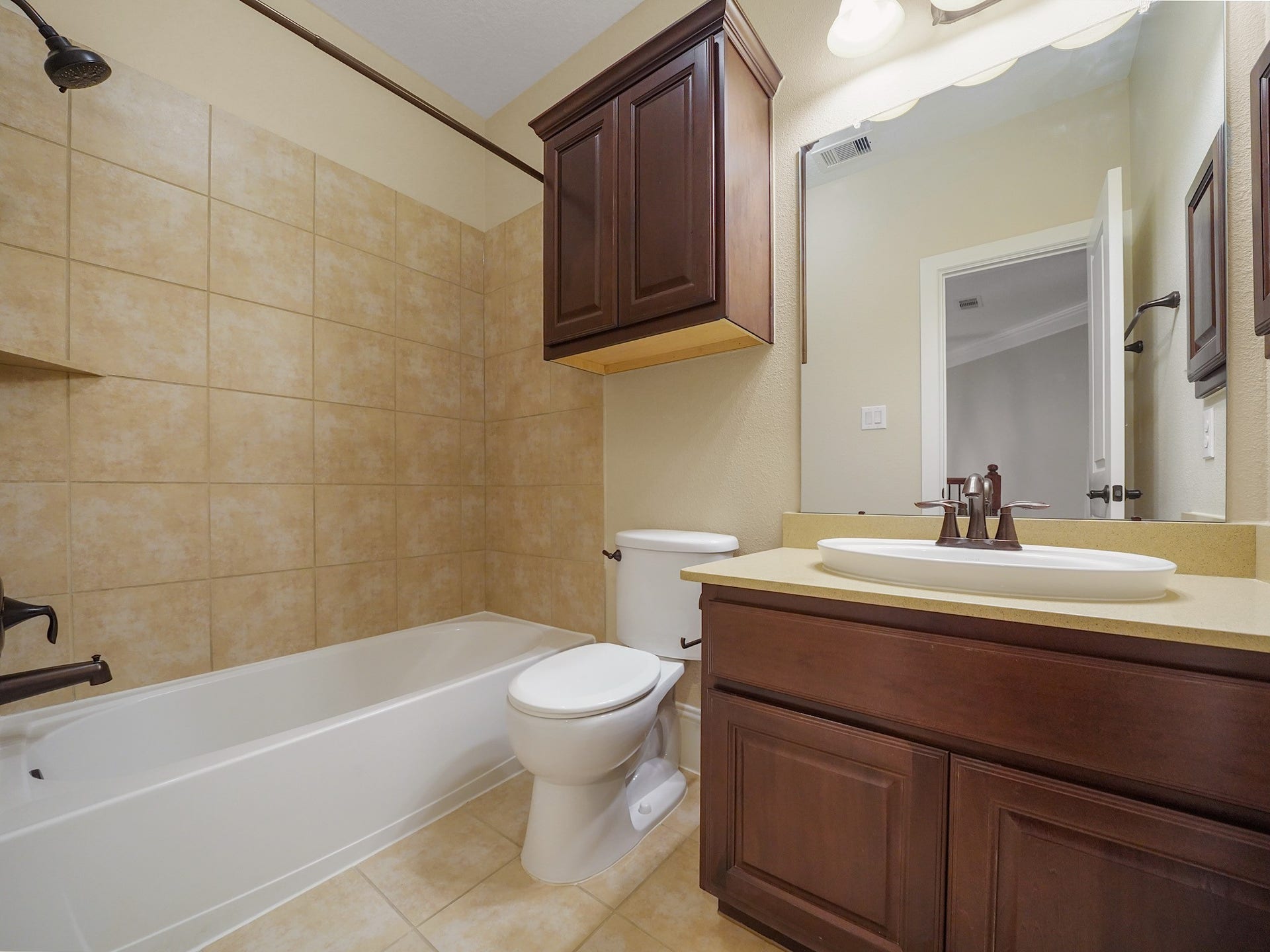 27710 Guthrie Ridge Lane, Katy, TX 77494 A nearby full bath pairs a tub/shower combination with a warm wood vanityan easy fit for busy mornings or overnight guests.