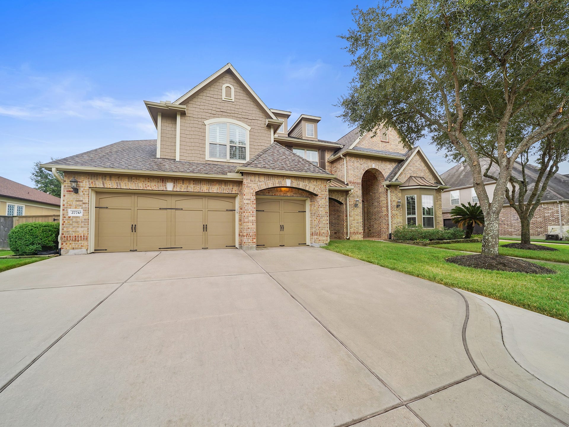27710 Guthrie Ridge Lane, Katy, TX 77494 A sweeping driveway and three-car garage create a polished arrival for guests and everyday living.