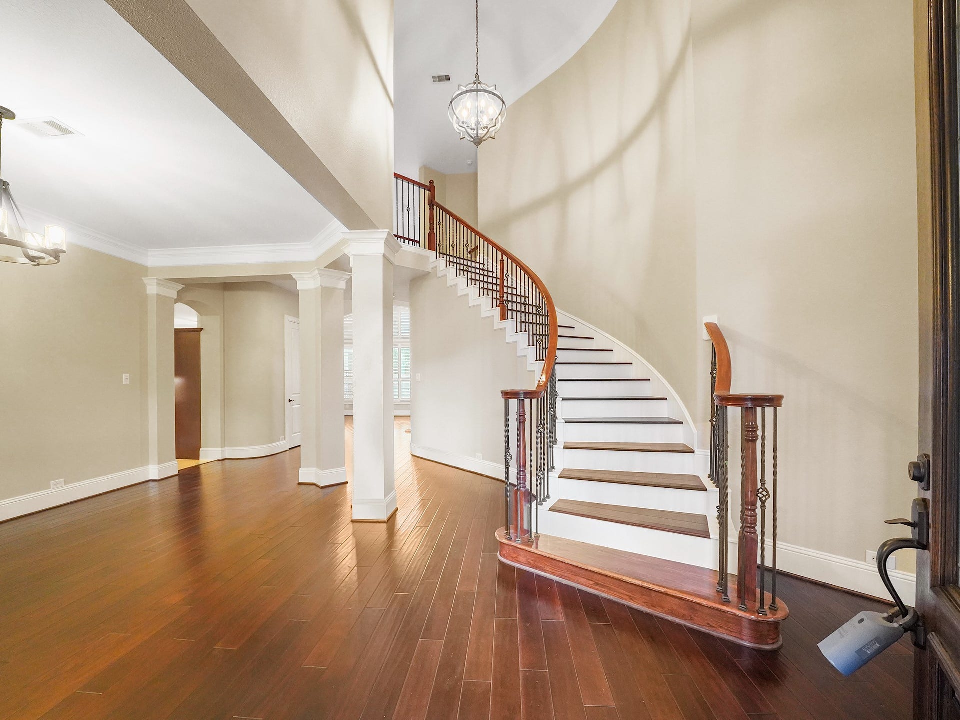 27710 Guthrie Ridge Lane, Katy, TX 77494 Inside, the grand foyer welcomes you with warm wood flooring, soaring ceilings, and a graceful curved staircasean elegant first look at the spaces beyond.