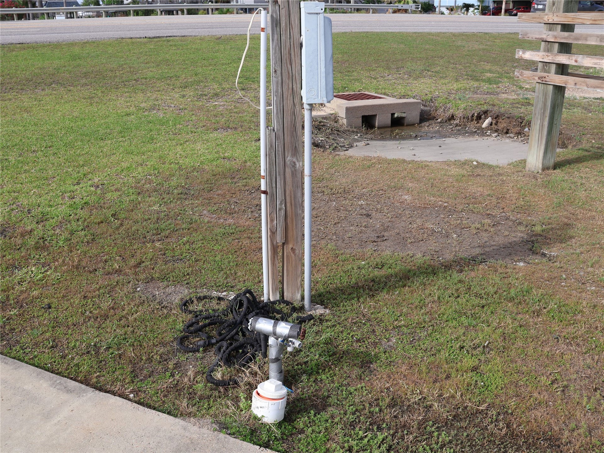3401 Highway 6, Hitchcock, TX 77563 This photo shows an RC hookup near Highway 6. There's a small concrete section with a drainage grate.