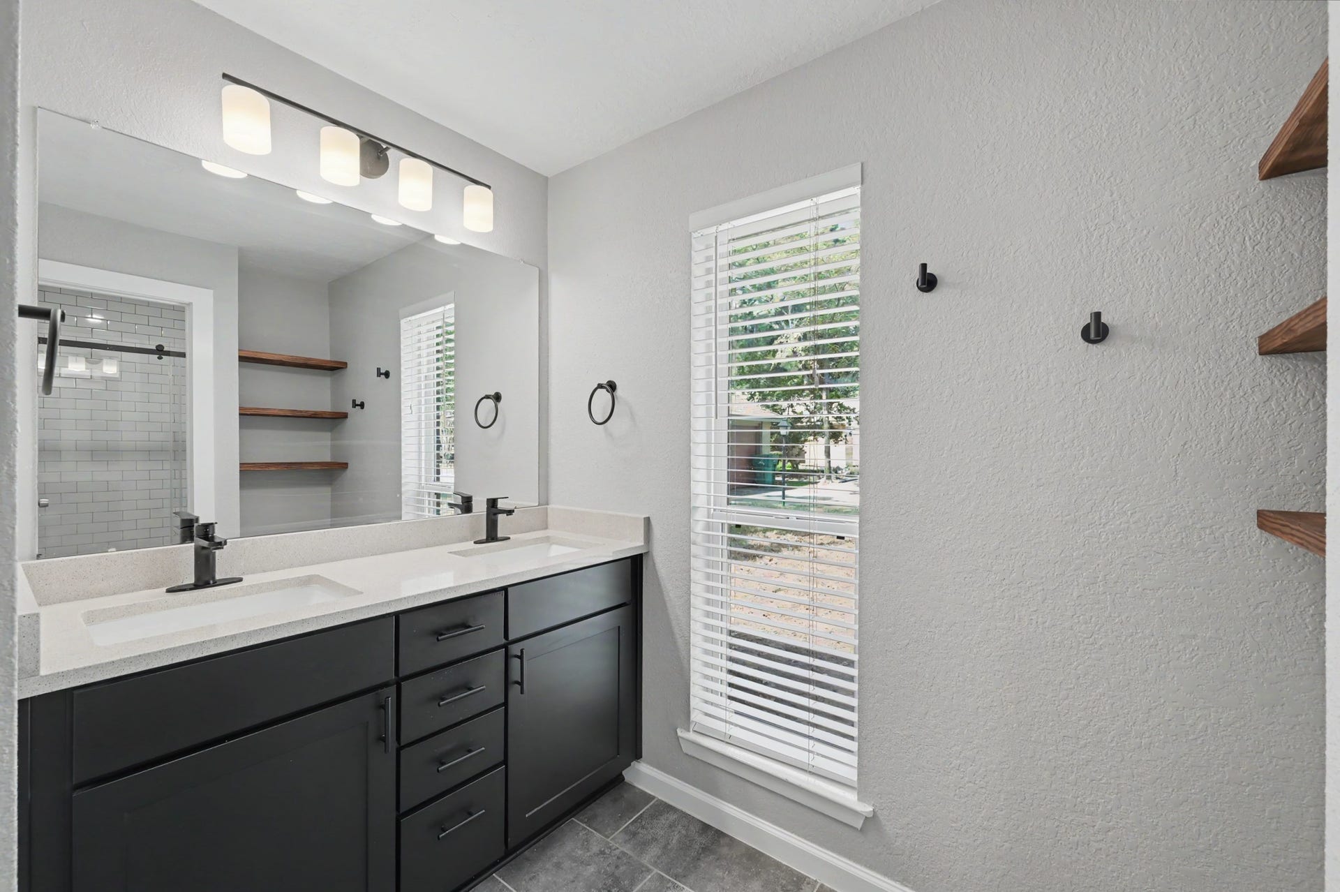 The double sinks and oversized walk-in shower complete the en suite bathroom.