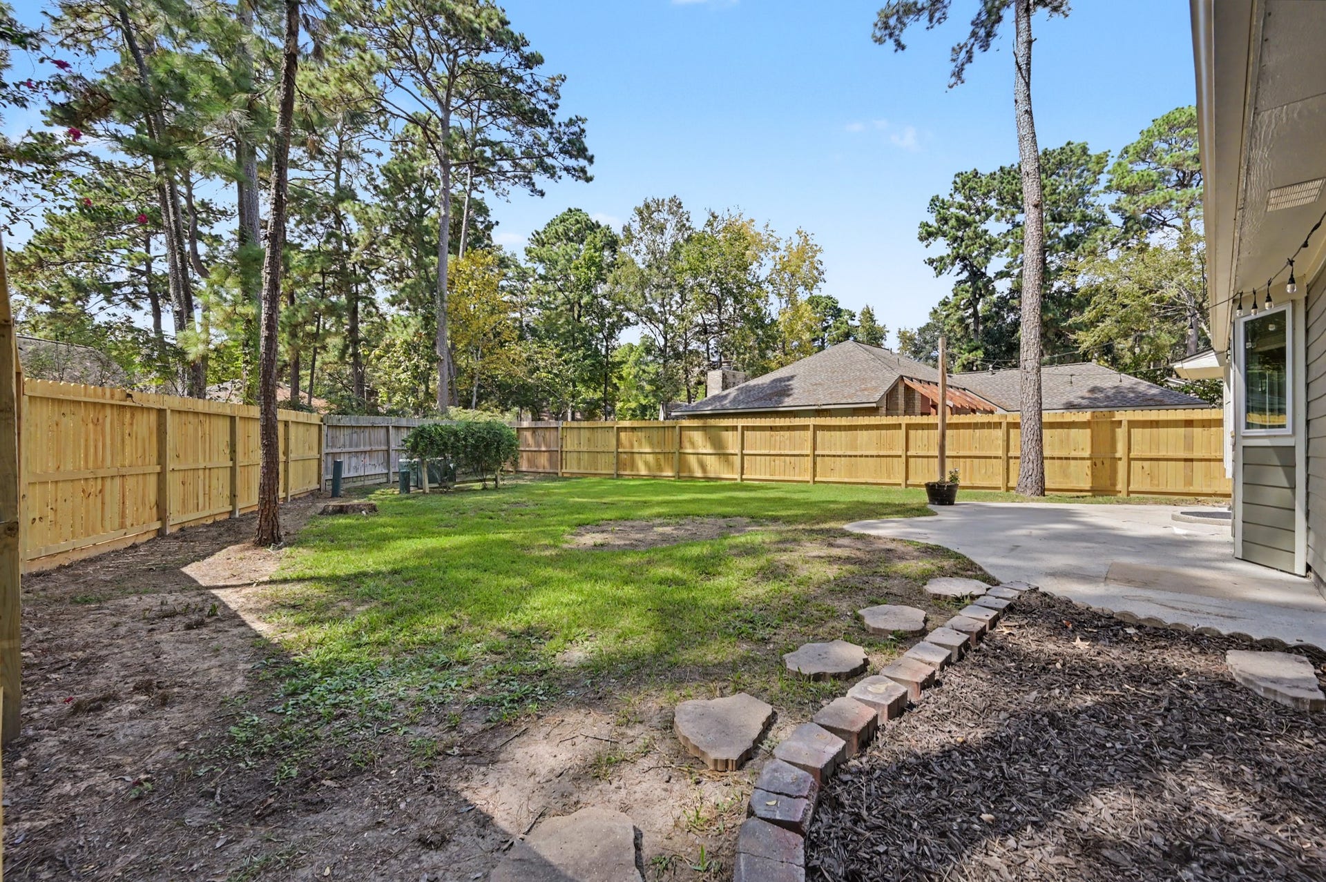 The newly fenced backyard provides great space to enjoy.