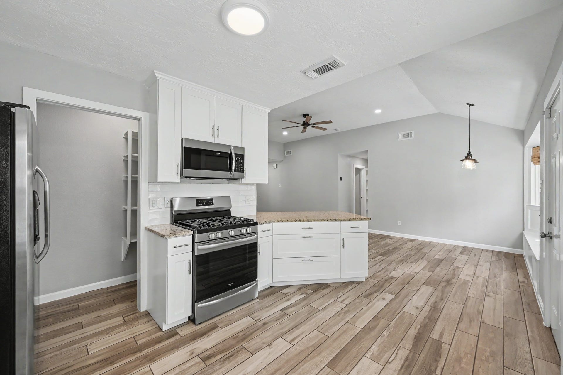 There is even a pocket door which leads to the walk in Coffee Bar and Pantry.