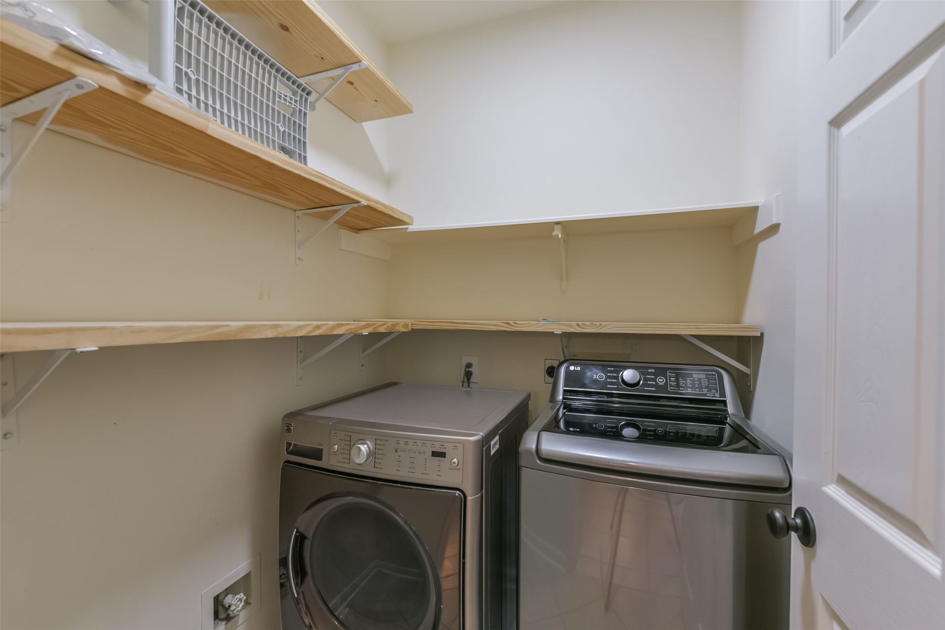 2509 S Mission Circle, Friendswood, TX 77546 Enjoy the convenience of an in-home laundry room with included washer and dryer, complemented by ample shelving for organized storage.