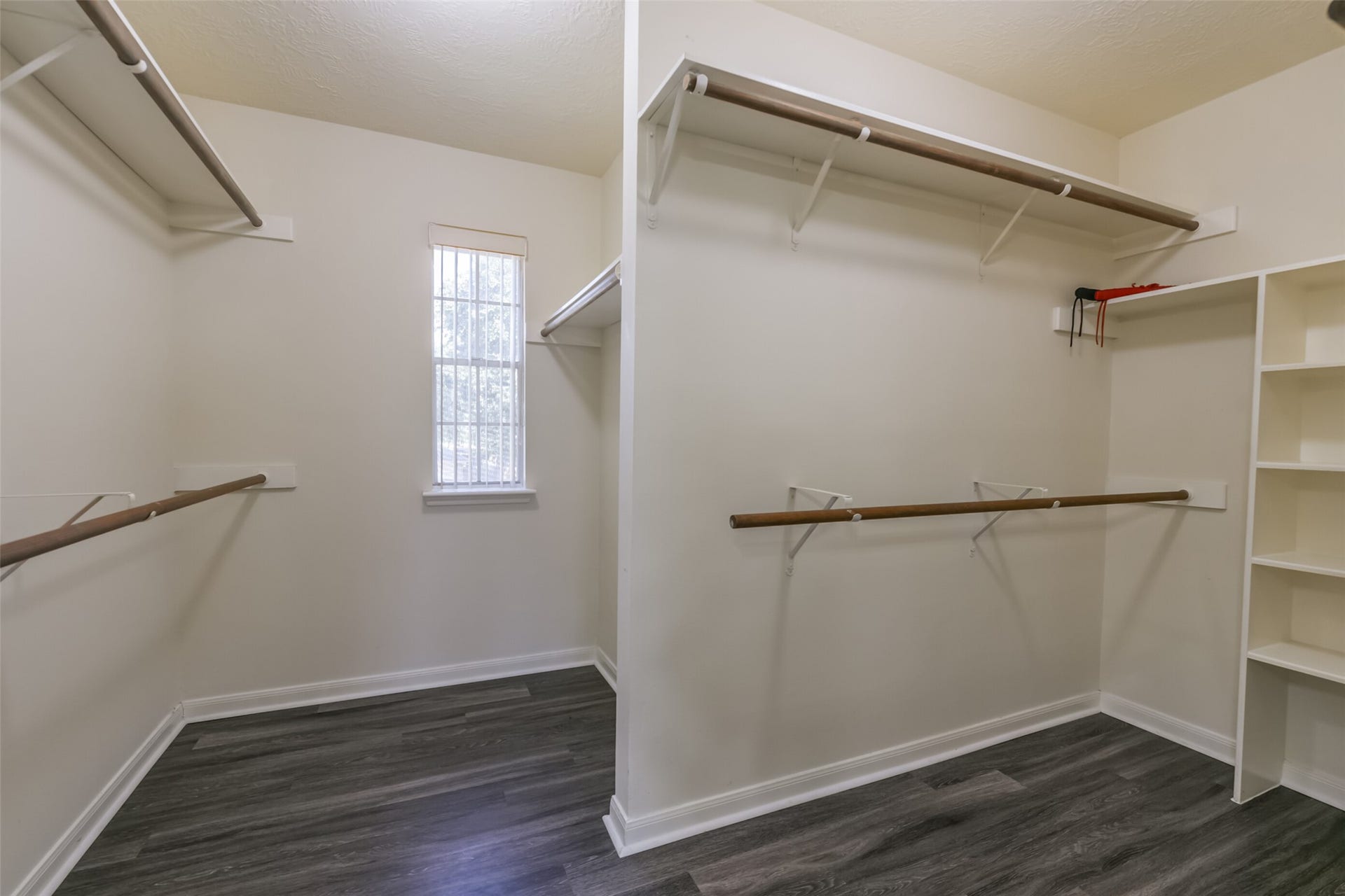 2509 S Mission Circle, Friendswood, TX 77546 Discover the luxury of abundant storage with this extra-large walk-in closet, offering ample space to organize and showcase your wardrobe.