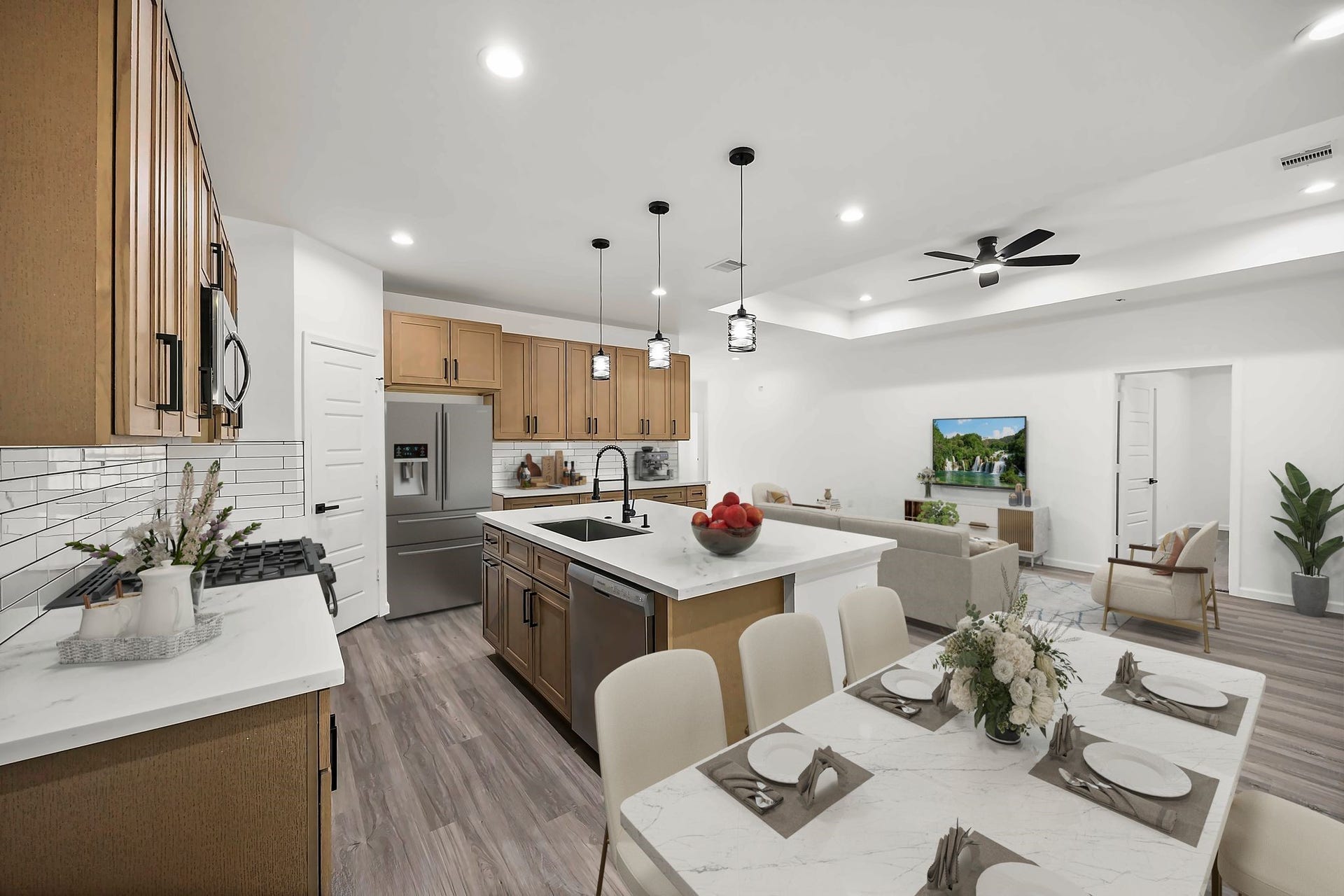 10426 Royal Oaks Drive, Houston, TX 77016 Spacious open-concept kitchen and living area featuring modern cabinetry, a large island with seating, and sleek stainless steel appliances.