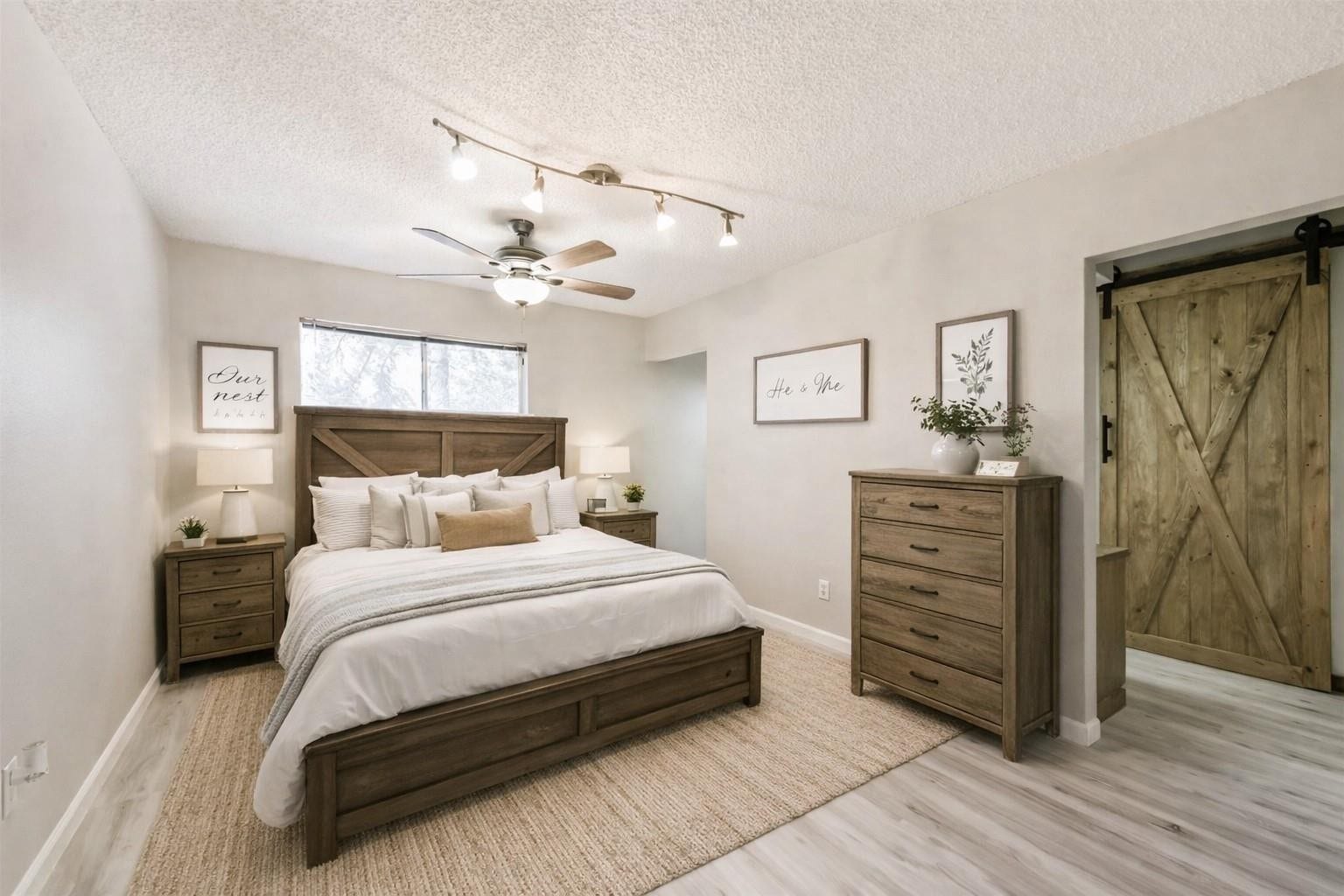 410 Riverside Drive, Alvin, TX 77511 Virtually staged primary bedroom with en-suite bath.