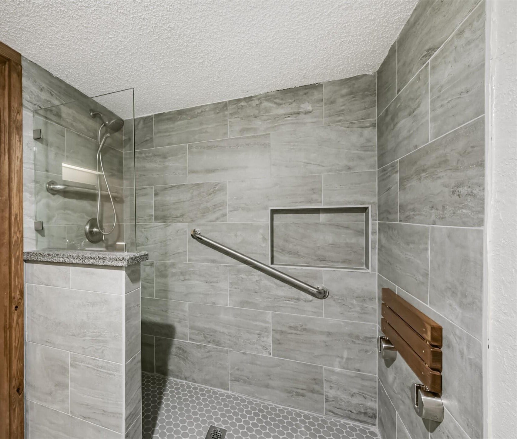 410 Riverside Drive, Alvin, TX 77511 The walk-in shower is level on the ground. There is no step you must step over to get in.