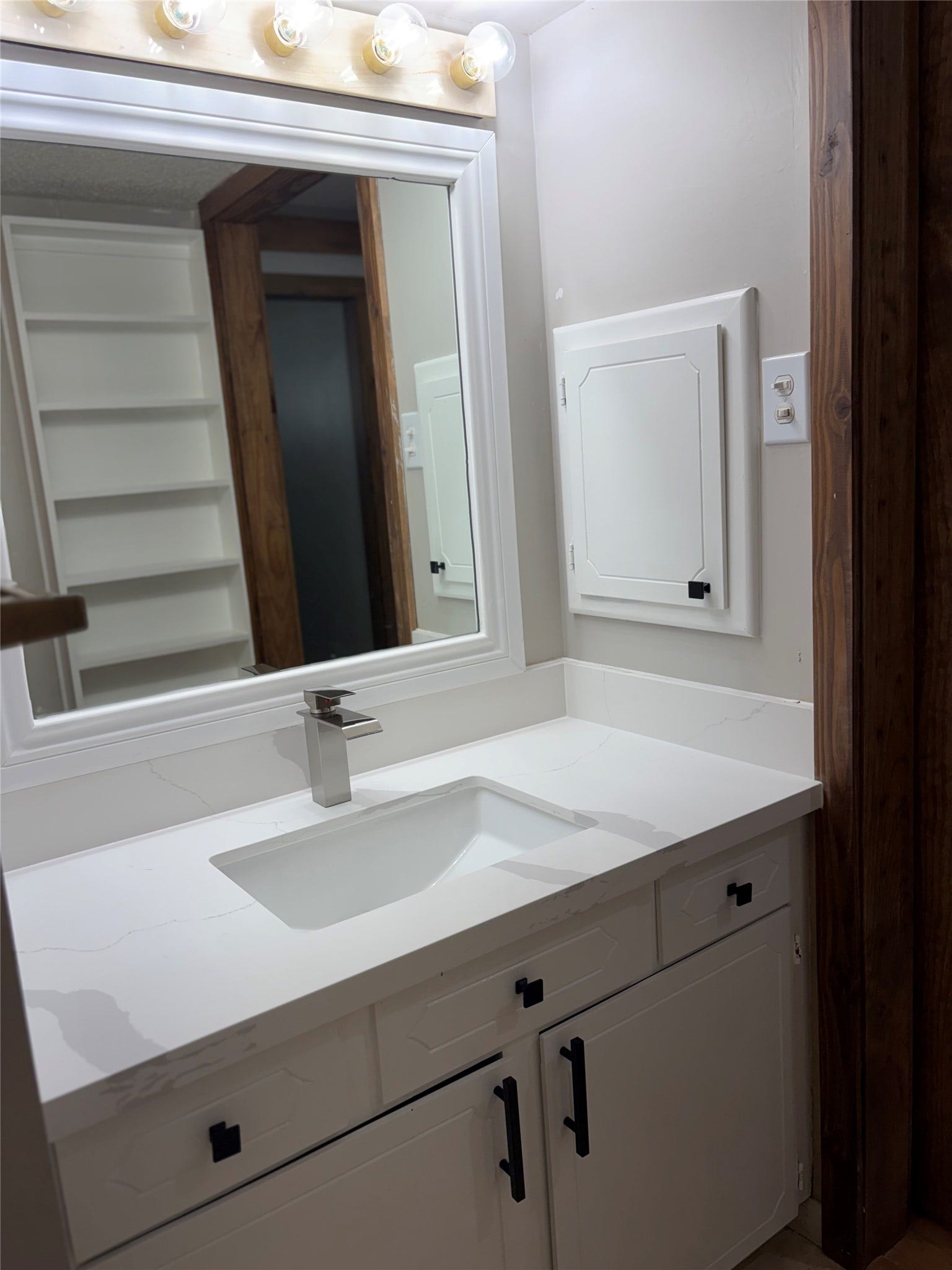 410 Riverside Drive, Alvin, TX 77511 You have extra storage in the hall bath with the shelves and medicine cabinet.