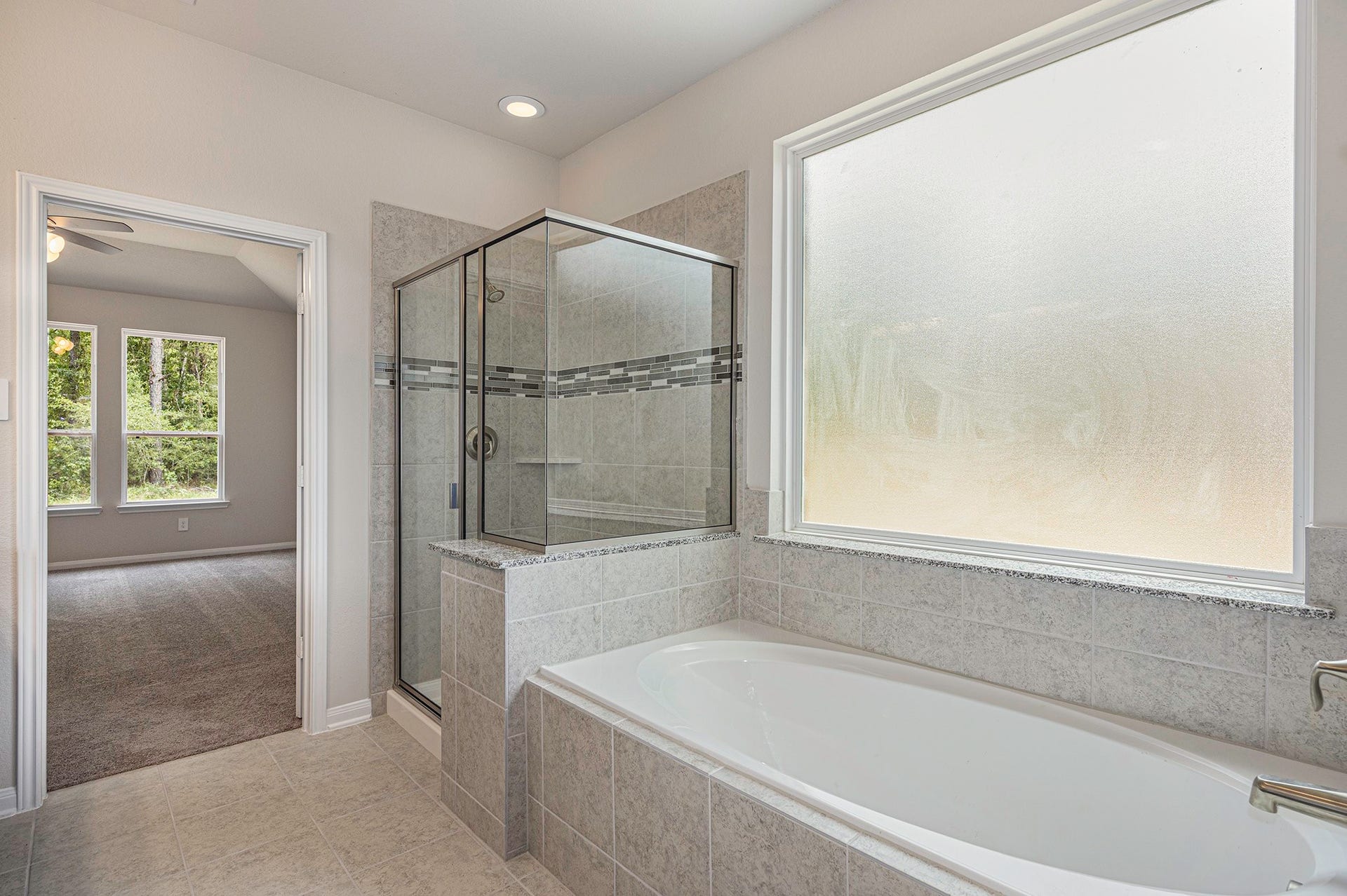 13264 Frio Falls, Conroe, TX 77303 Brand New stunning 2 story home! Photos are representation of the Winkler Floor plan. Colors & Selections may vary. Hurry Call Today to schedule your private showing! tub and separate shower!