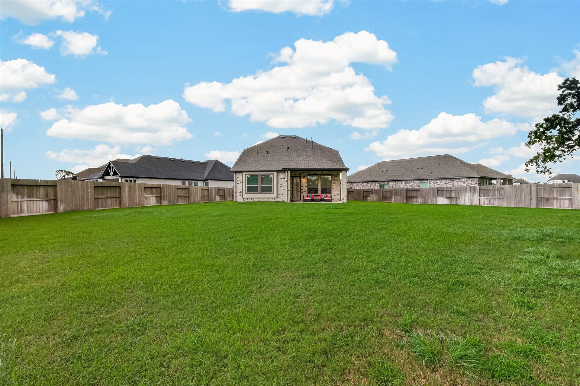 10730 Hidden Rock Drive, Missouri City, TX 77459 Backyard view of the spacious .35-acre lot, providing an ideal canvas to construct your own custom lazy river or a personalized outdoor oasis.