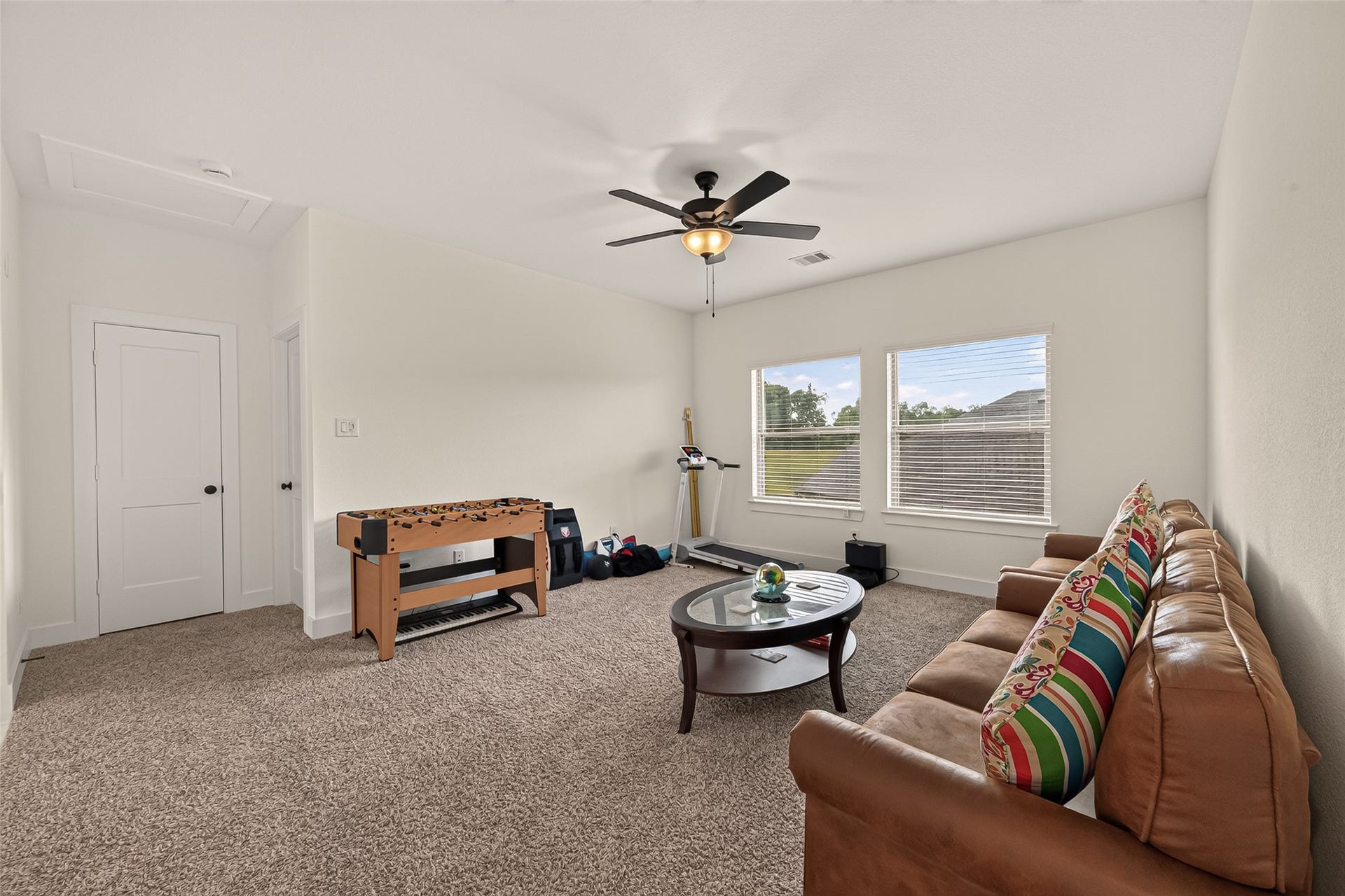 10730 Hidden Rock Drive, Missouri City, TX 77459 This image depicts the entrance to a secondary bedroom, conveniently situated behind the family and game room, which also features an integrated storage closet.