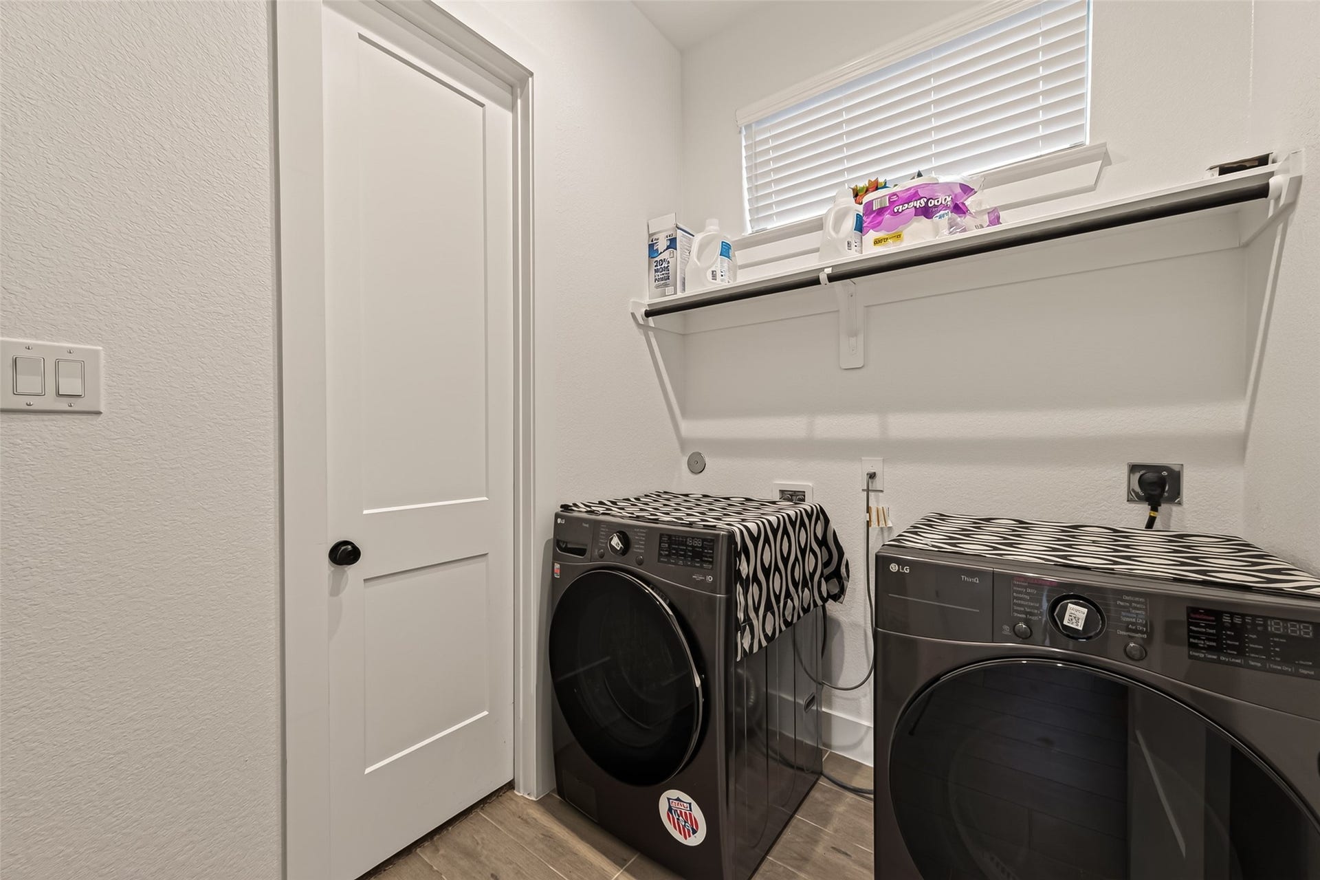 10730 Hidden Rock Drive, Missouri City, TX 77459 Conveniently located laundry room adjacent to the guest bedroom, featuring a direct pass-through entrance into the primary closet for seamless access.
