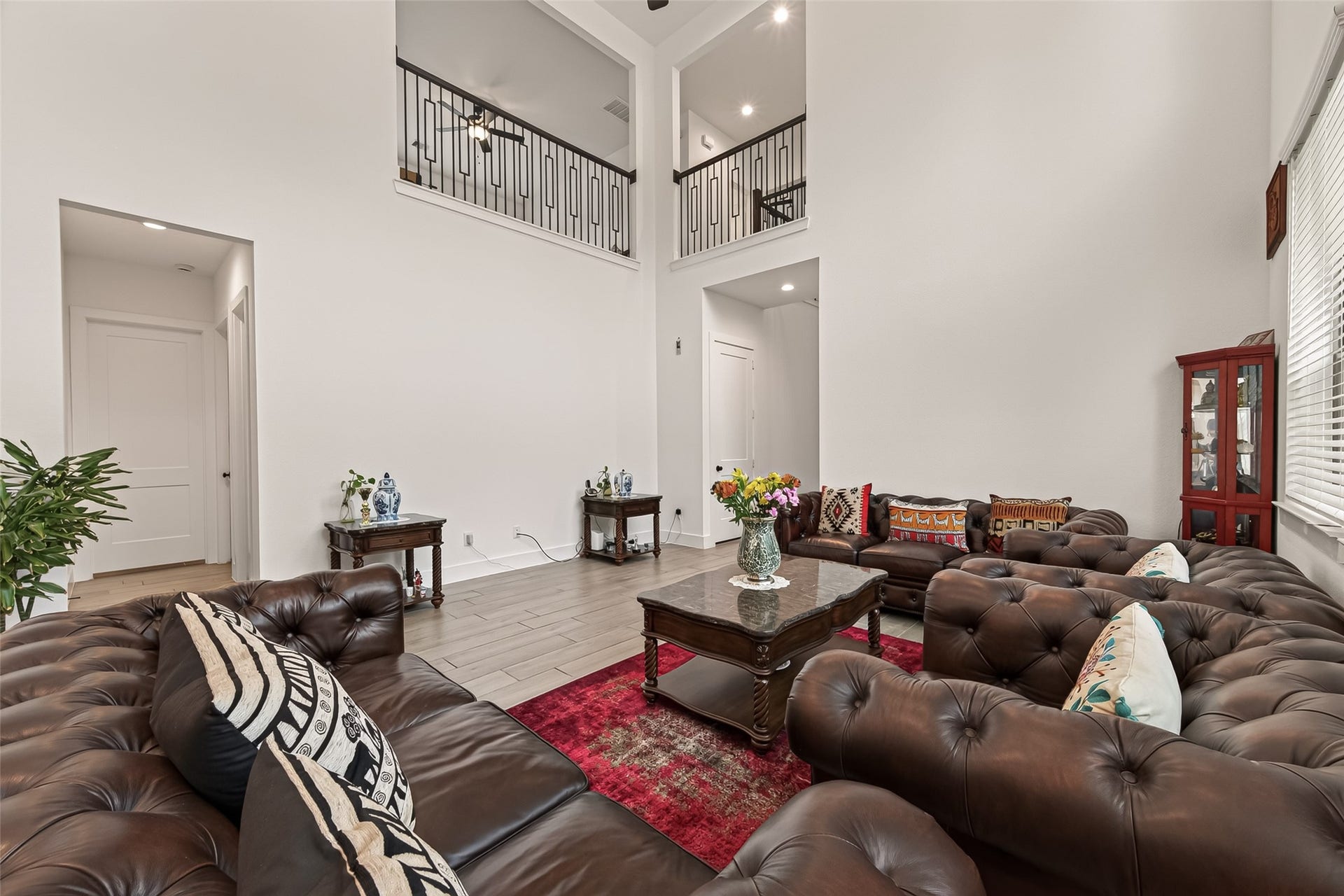 10730 Hidden Rock Drive, Missouri City, TX 77459 Open-concept floor plan with a view from the upstairs balcony overlooking the family room, perfect for seamless communication and effortless entertaining.