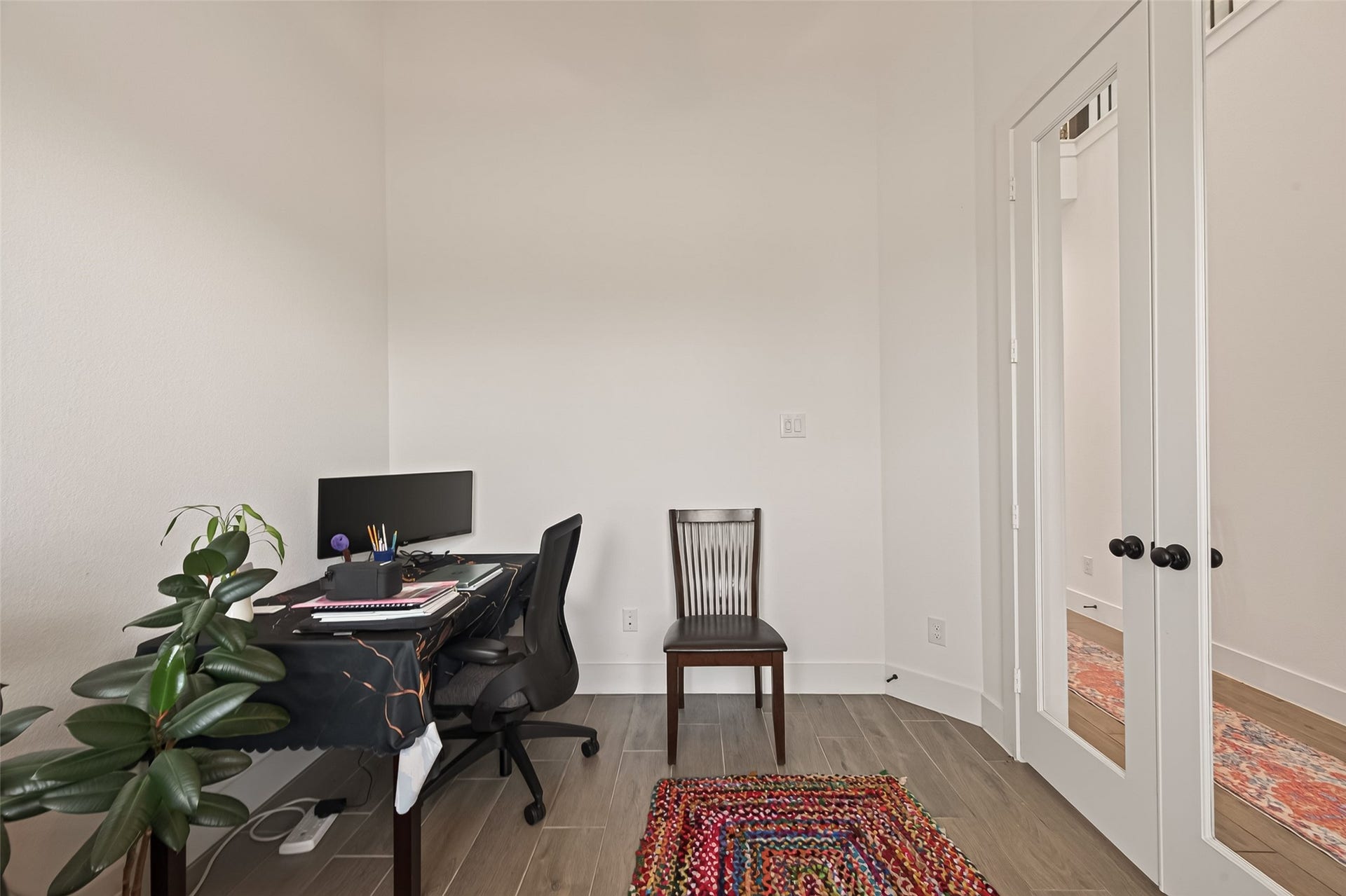 10730 Hidden Rock Drive, Missouri City, TX 77459 Spacious home office featuring elegant tile flooring, dual glass doors for enhanced privacy, and an expansive layout easily accommodating two desks.