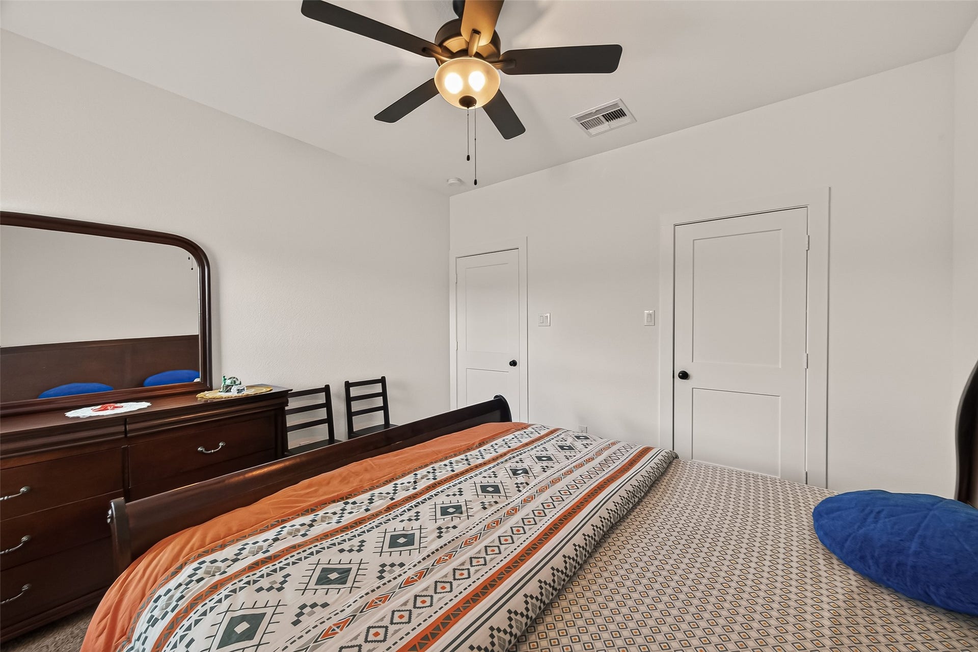 10730 Hidden Rock Drive, Missouri City, TX 77459 Secondary bedroom located behind the game/family room; spacious layout featuring a ceiling fan and a large closet.