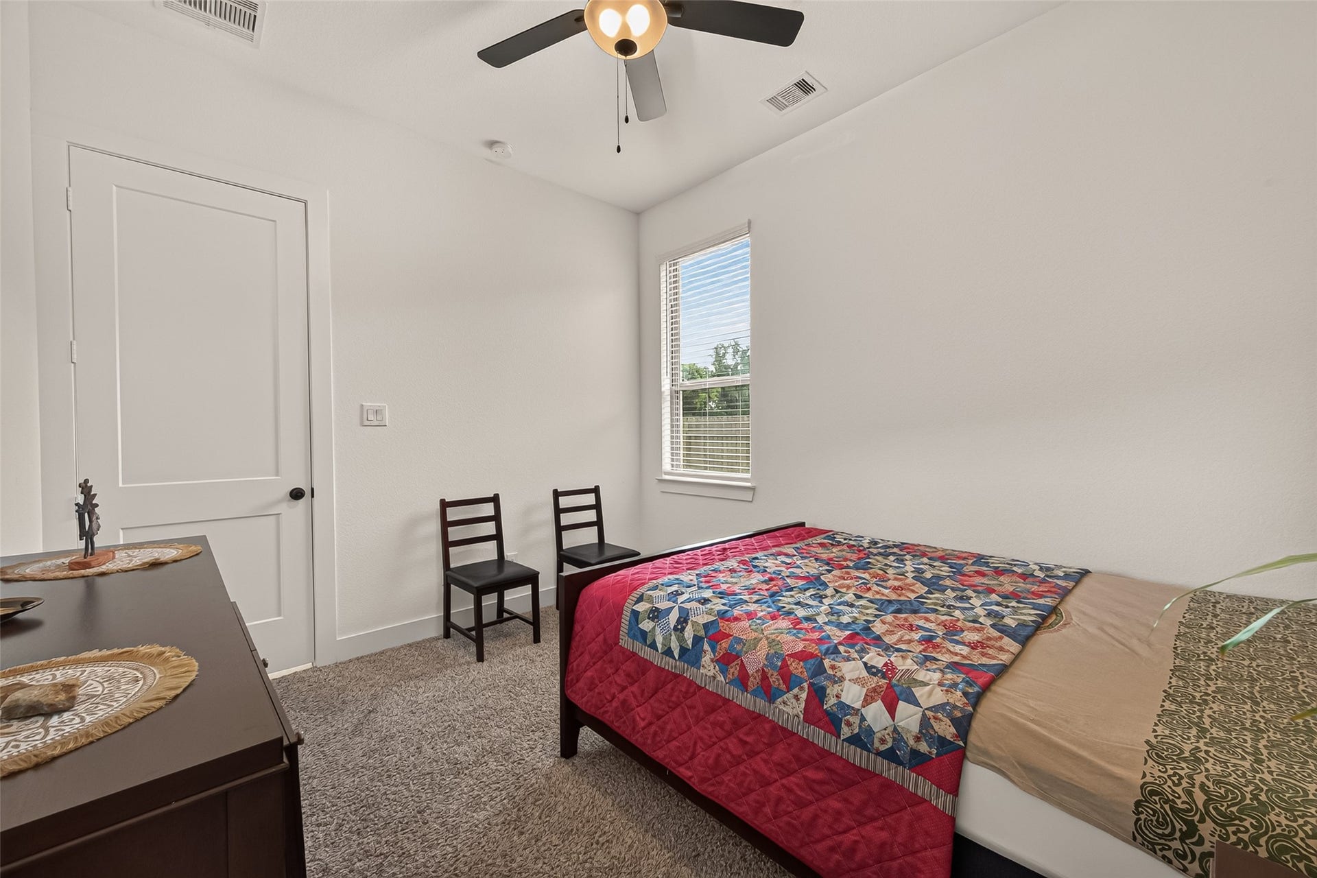 10730 Hidden Rock Drive, Missouri City, TX 77459 Spacious guest bedroom with ample floor space and natural light, offering versatile layout options and a comfortable, welcoming atmosphere. ( 2nd view)