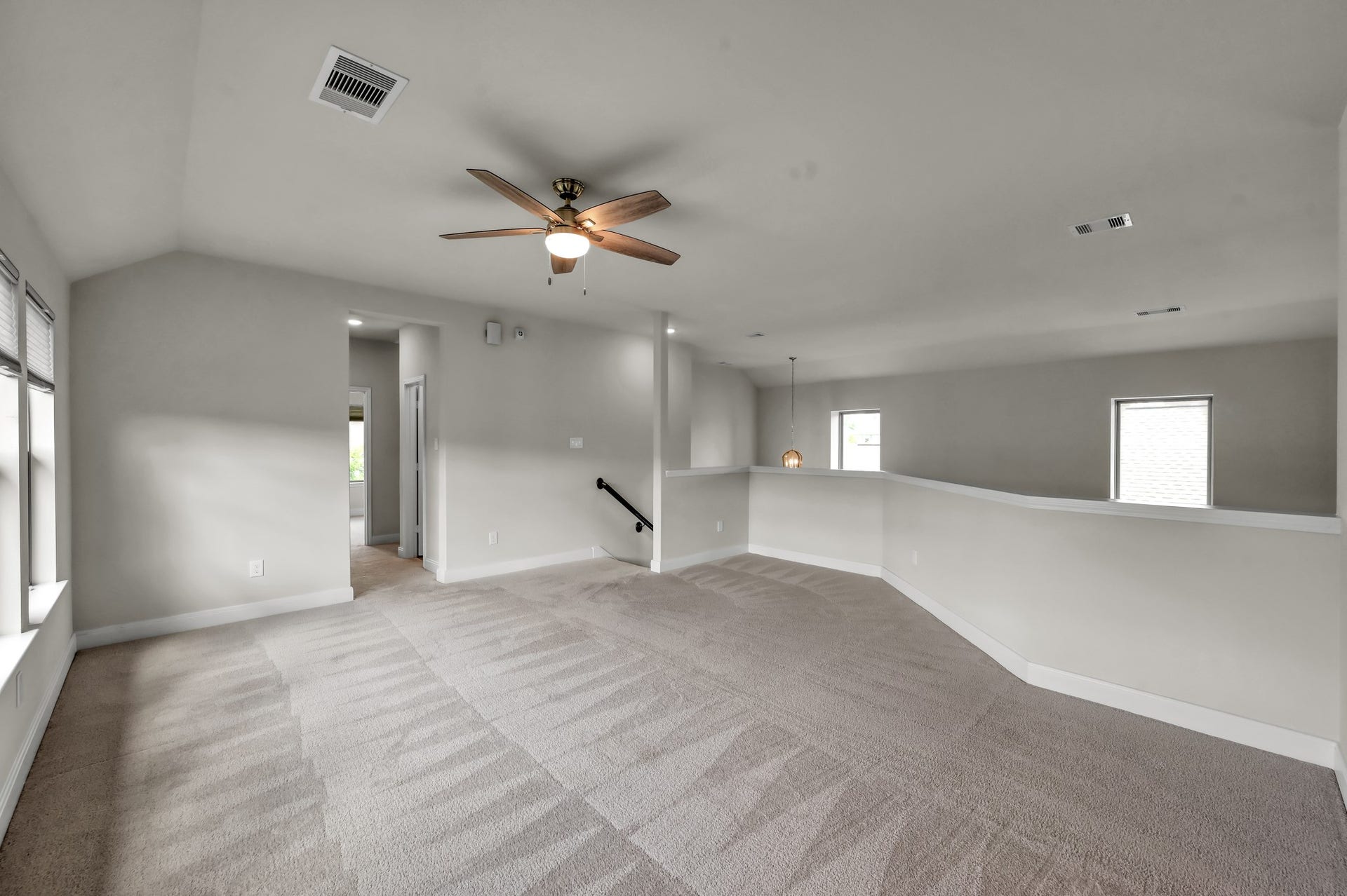 550 Chestnut Reef Court, Conroe, TX 77304 Additional view of the spacious upstairs game room, offering plenty of room for relaxing, play, and entertaining.