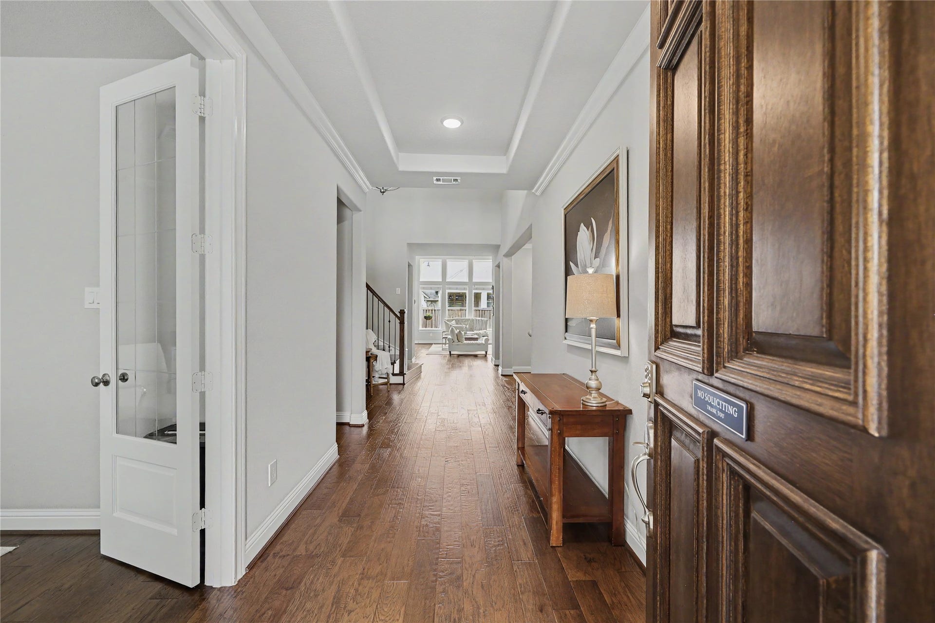 28216 Regal Wood Court, Spring, TX 77386 Entry foyer with wood flooring, decorative molding, and views into the home.