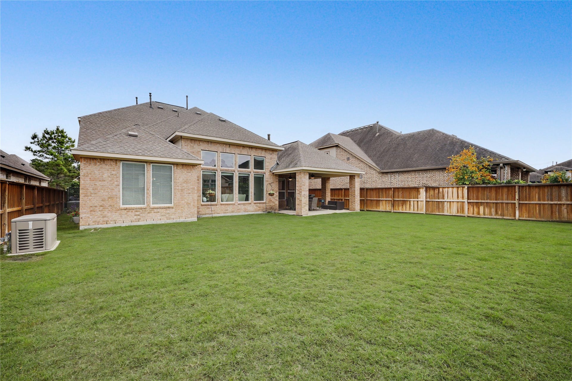 28216 Regal Wood Court, Spring, TX 77386 Spacious backyard with green lawn and room for outdoor living.