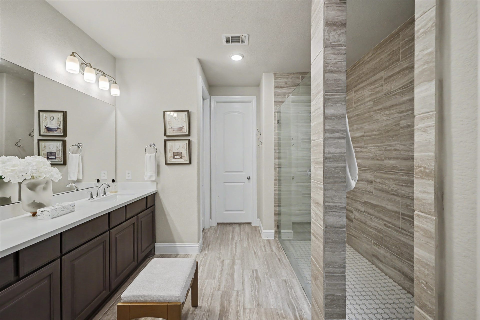 28216 Regal Wood Court, Spring, TX 77386 Primary bathroom with dual vanities, soaking tub, and separate walk-in shower.