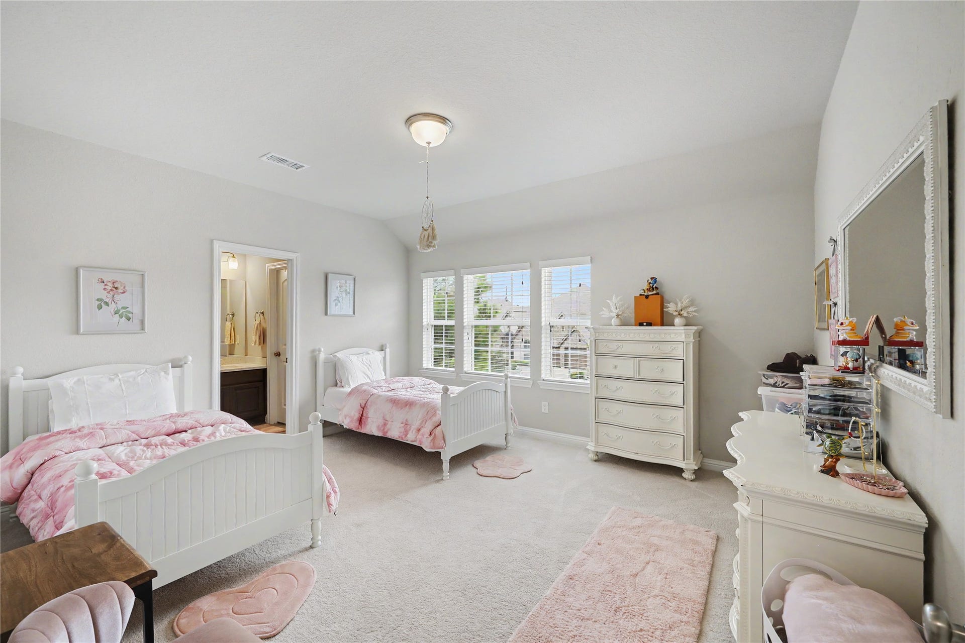 28216 Regal Wood Court, Spring, TX 77386 Secondary bedroom with neutral finishes, ceiling fan, and multiple windows.