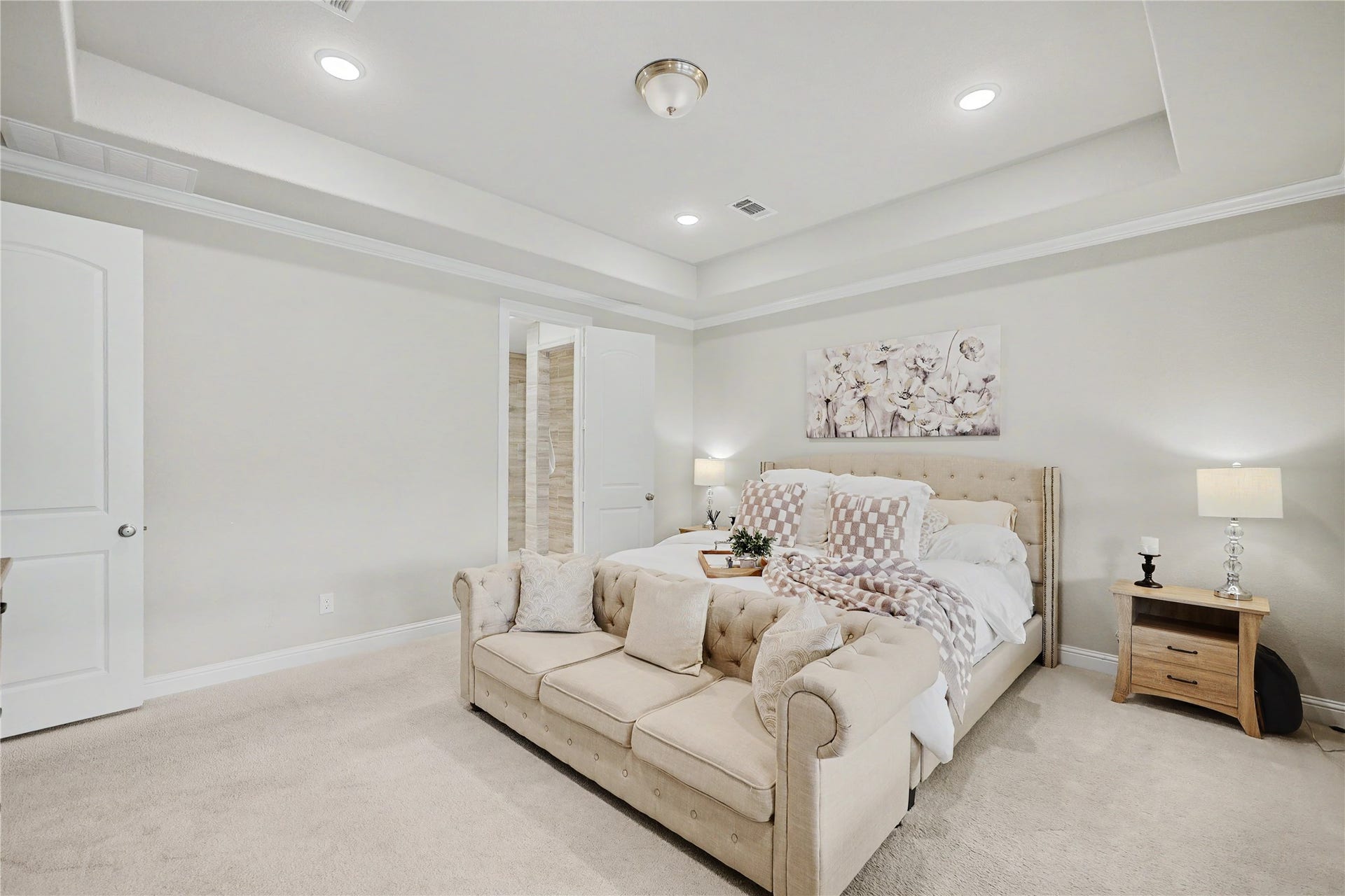28216 Regal Wood Court, Spring, TX 77386 Additional view of the primary suite featuring a tray ceiling and neutral finishes.