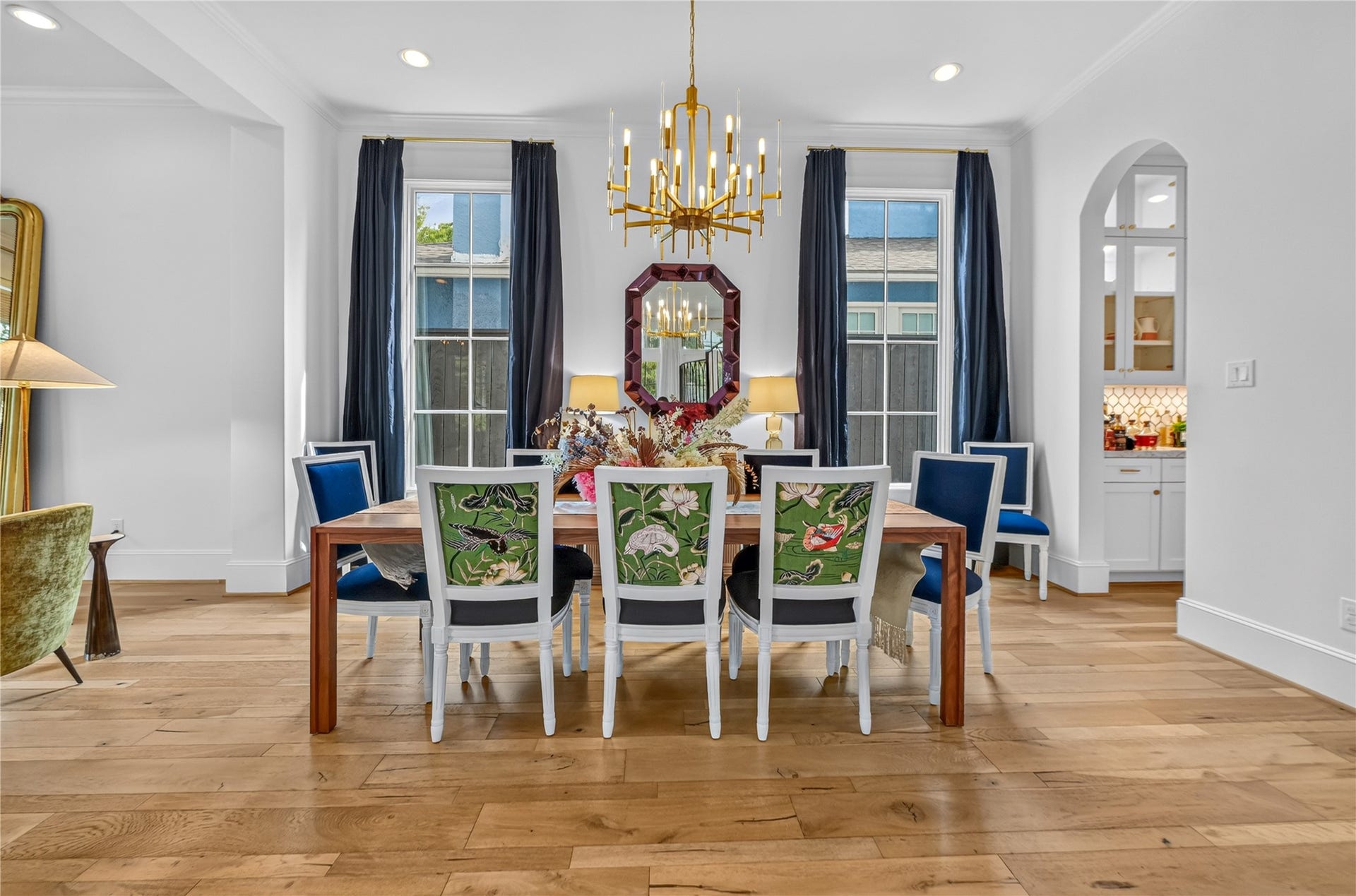 Dining room is elegant in nature with vast amounts of natural light from any angle.