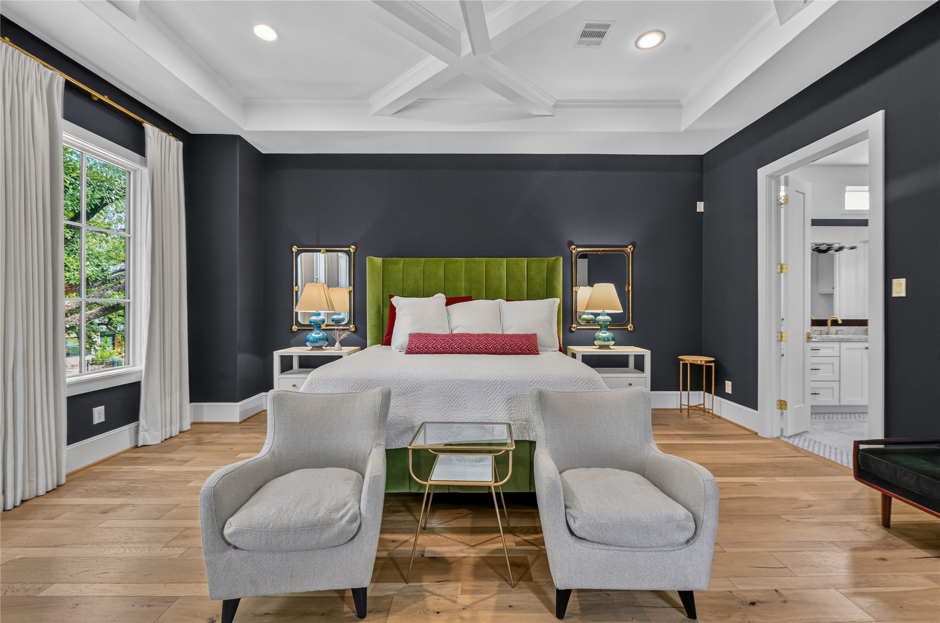 Primary bedroom is massive in size and feels like a tree house with the massive oak tree just outside your window