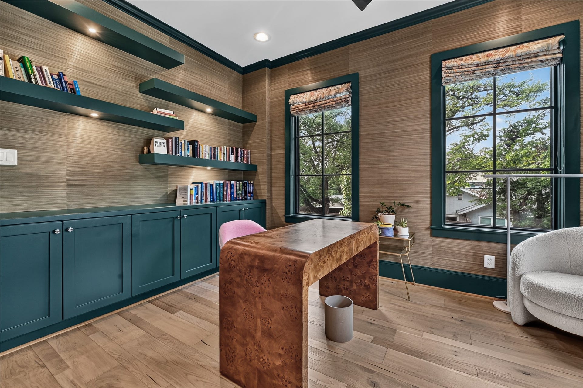 Home Office features custom wall paper, paint & overlooks your back yard & pool.