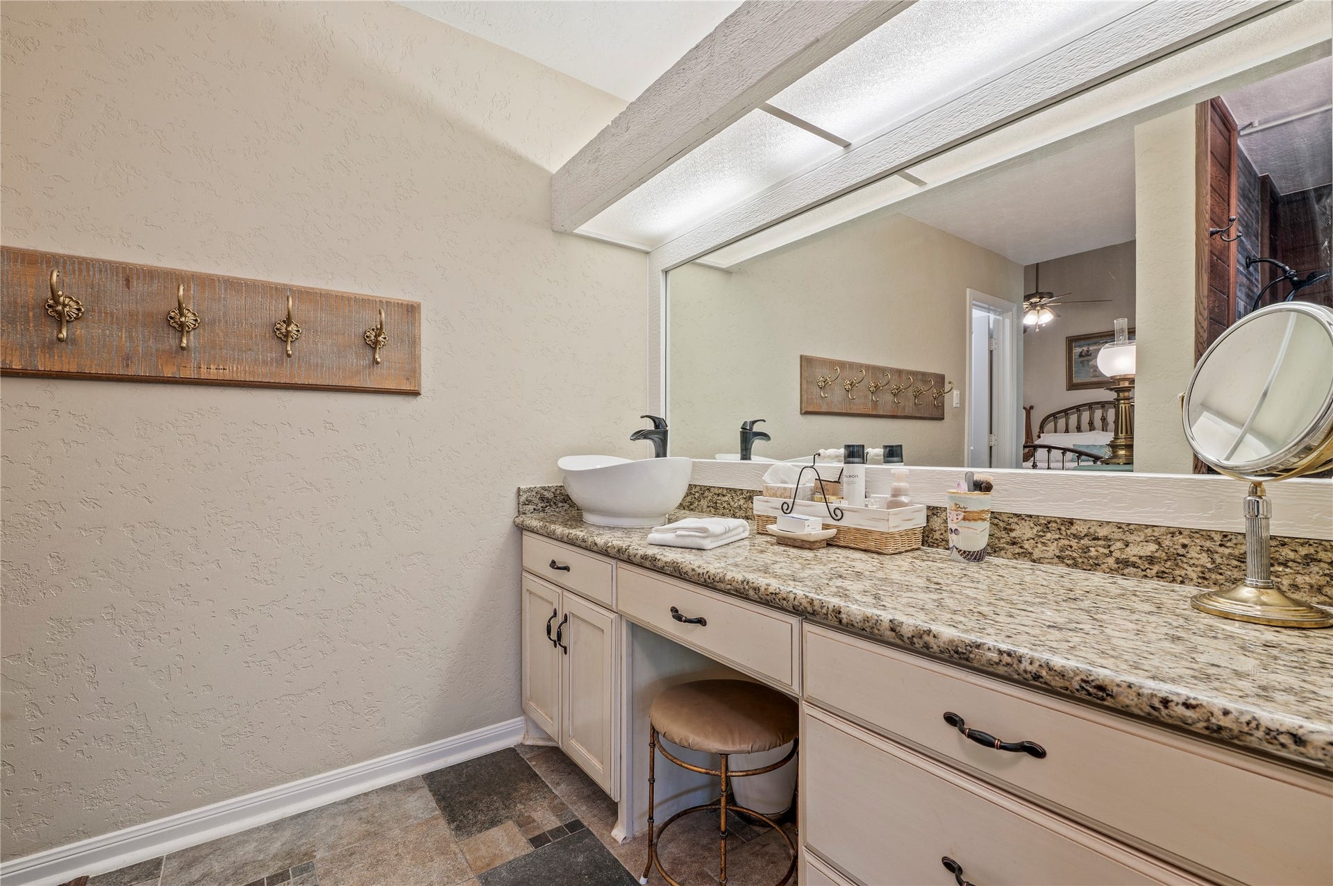 16530 Space Center Boulevard, Houston, TX 77058 Granite counter tops and tile flooring throughout the primary bath.