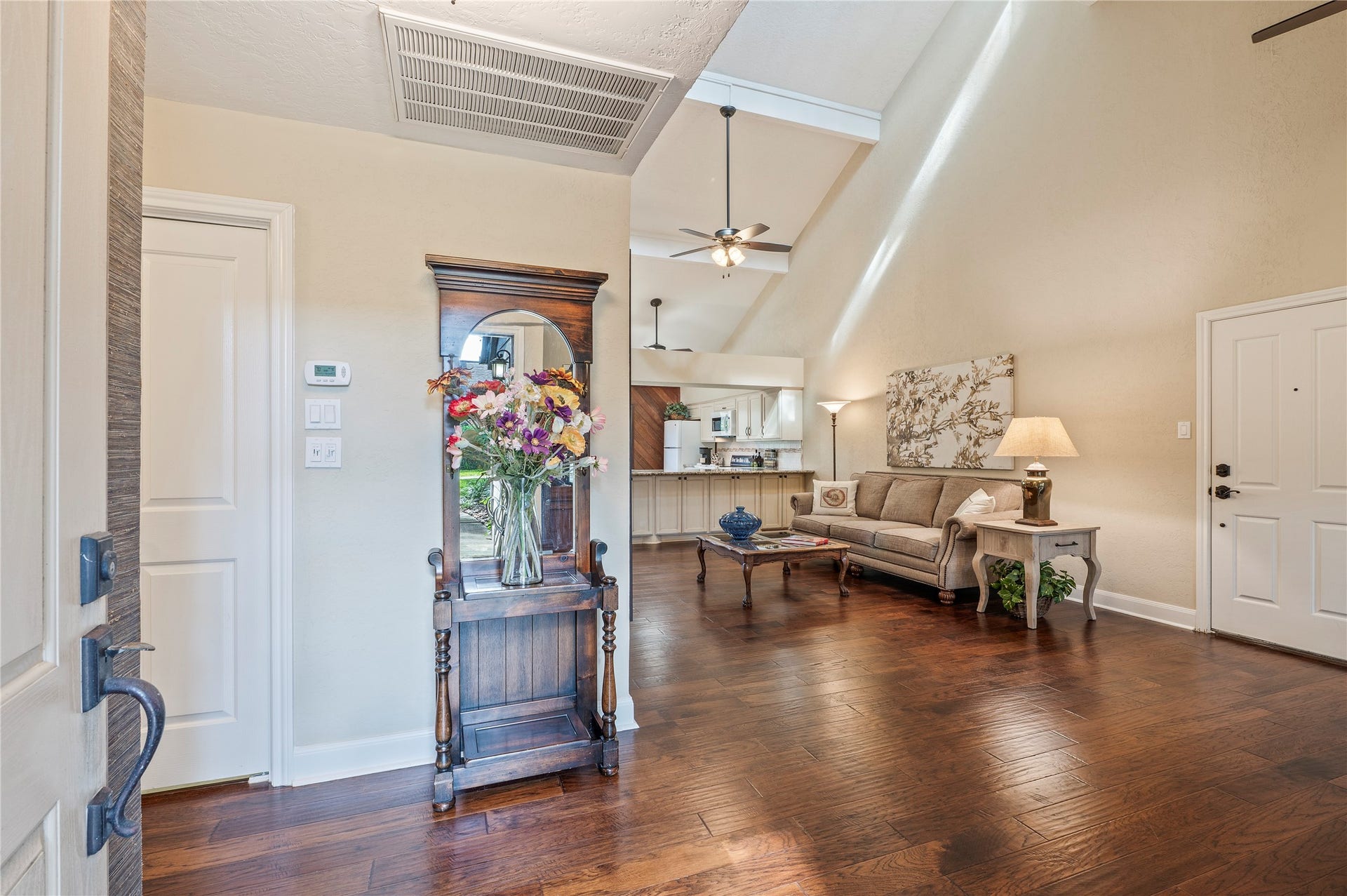 16530 Space Center Boulevard, Houston, TX 77058 Front door opens up to the large living room space with wood like flooring throughout.