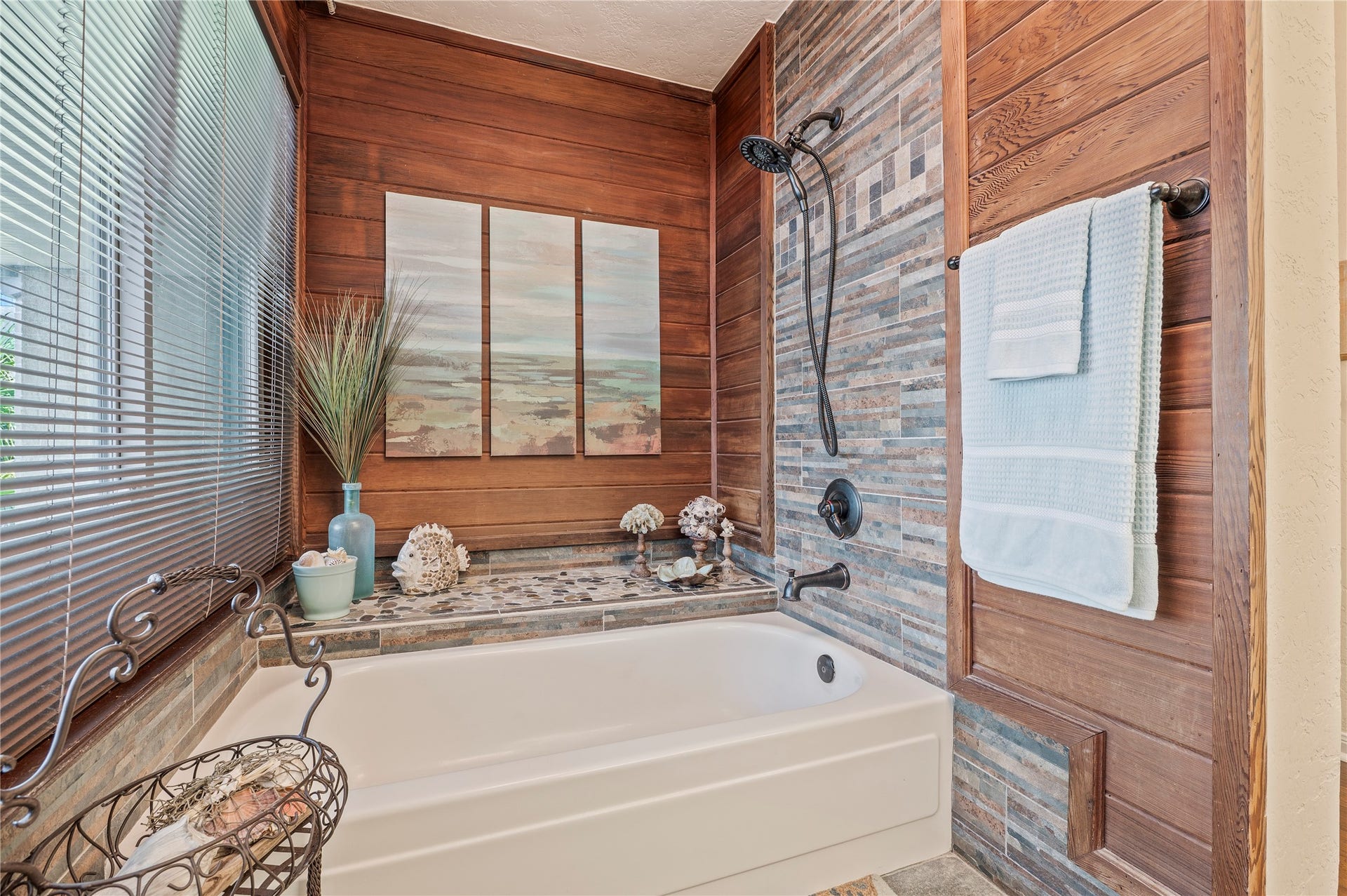 16530 Space Center Boulevard, Houston, TX 77058 Beautiful bath tub with stone and wood acccent walls.