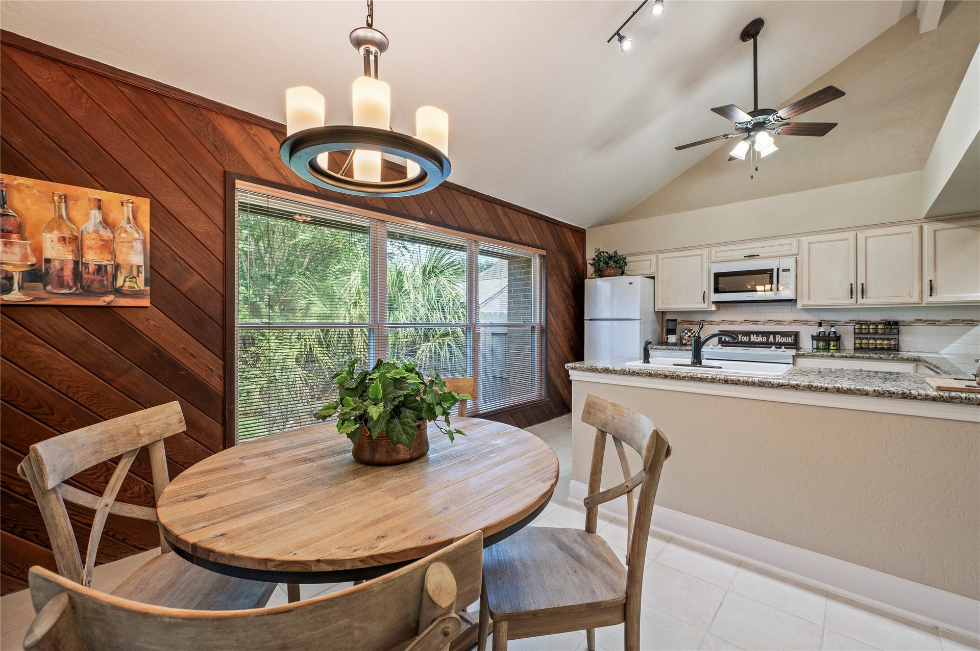16530 Space Center Boulevard, Houston, TX 77058 Large breakfast area with window for great natural lighting. Wood accent wall.