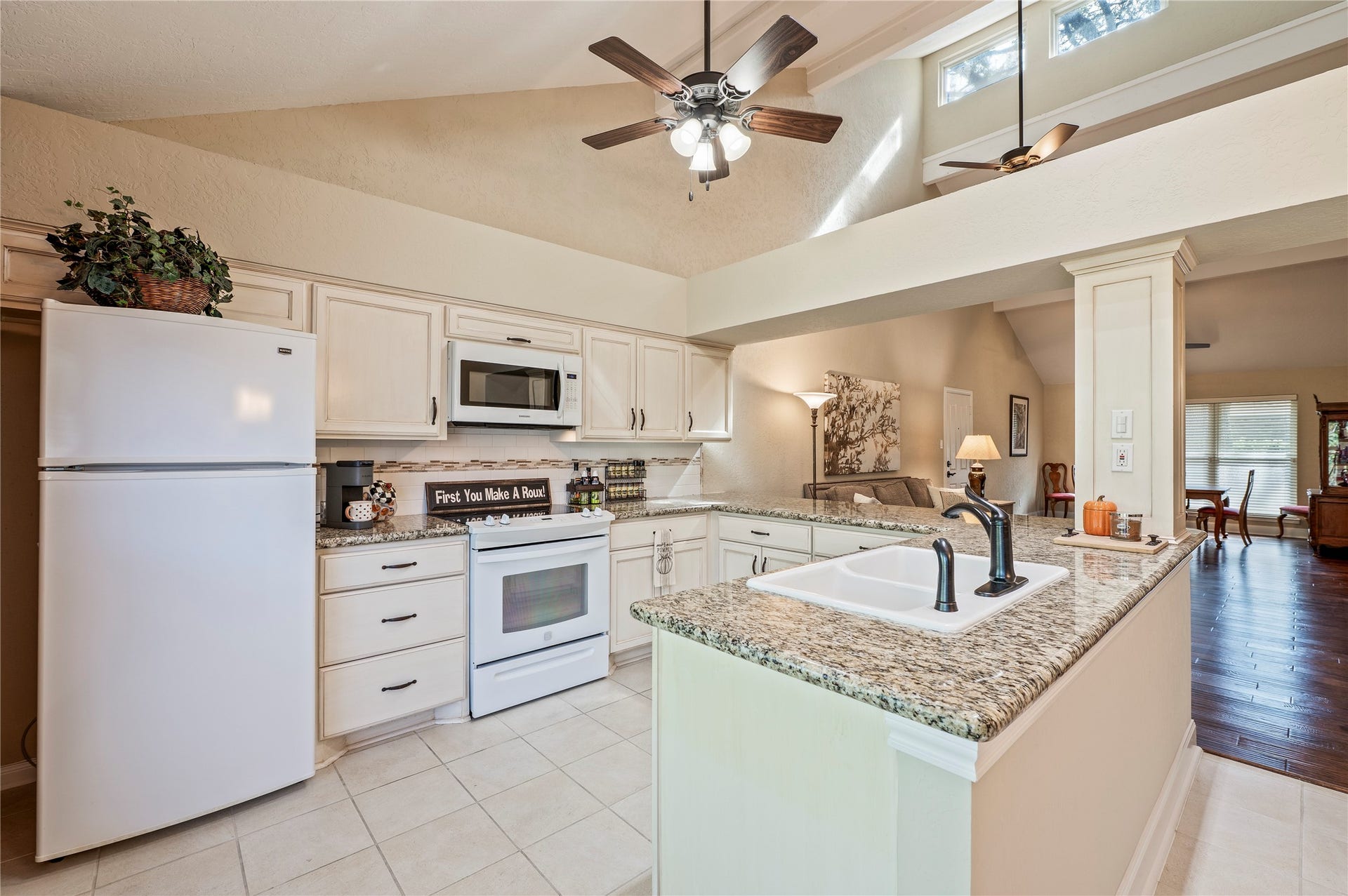 16530 Space Center Boulevard, Houston, TX 77058 Spacious kitchen with tile flooring, ample cabinet storage and granite counter tops..